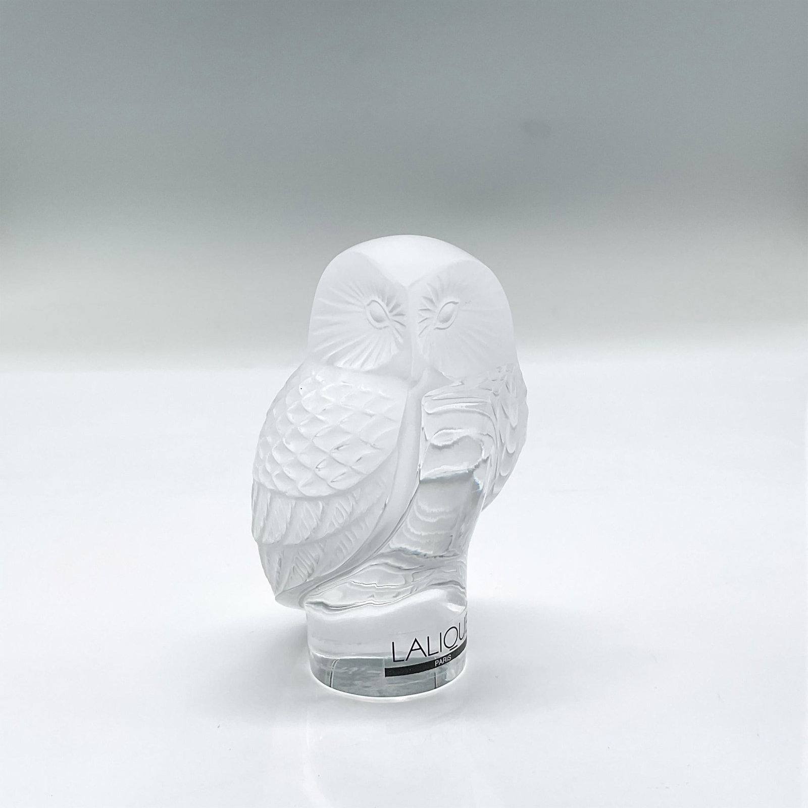Lalique Crystal Figurine, Shivers Owl: Frosted crystal figure of a perched attentive owl. Lalique France etched mark. Dimensions: 2.75"L x 2"W x 2.5"H Manufacturer: Lalique Country of Origin: France