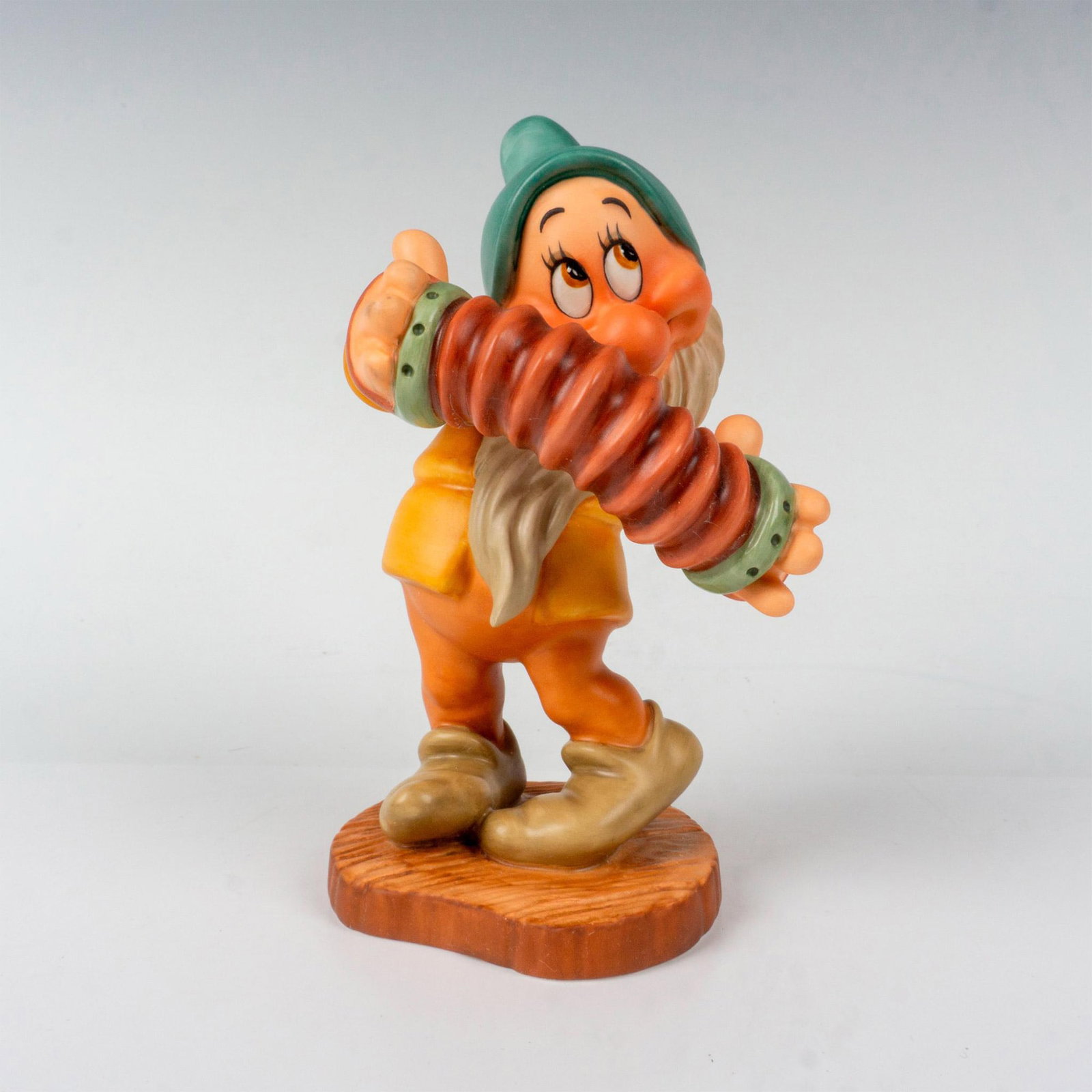 Walt Disney Classics Collection Figurine, Bashful: Seven Dwarf from the 1937 animated Classics film. Stamped to base Walt Disney Classicss Collection Snow White and the Seven Dwarfs, Aw Shucks. Comes with certificate of authenticity. Includes original