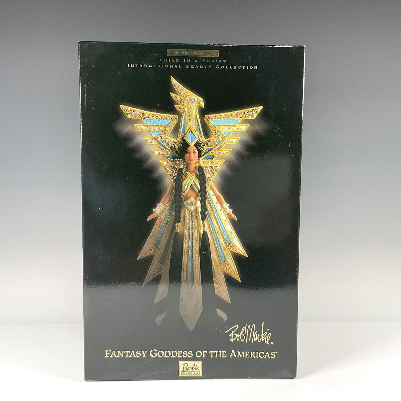 Mattel Barbie Doll, Fantasy Goddess of the Americas: Limited edition, third in the series, International Beauty Collection. New in original box. She is dressed in a Bob Mackie designed sunburst gown and sequined headdress. Barbie Collectibles copyright