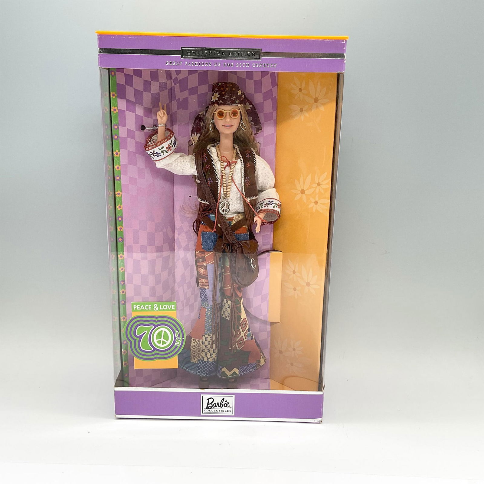 Mattel Collector Edition Barbie Doll, Peace & Love 70's: A Barbie Collectibles, and the seventh in the Great Fashions of the 20th Century collection. Barbie is shown in a long sandy-brown hair and groovy attire. She is displayed in her original and unopened