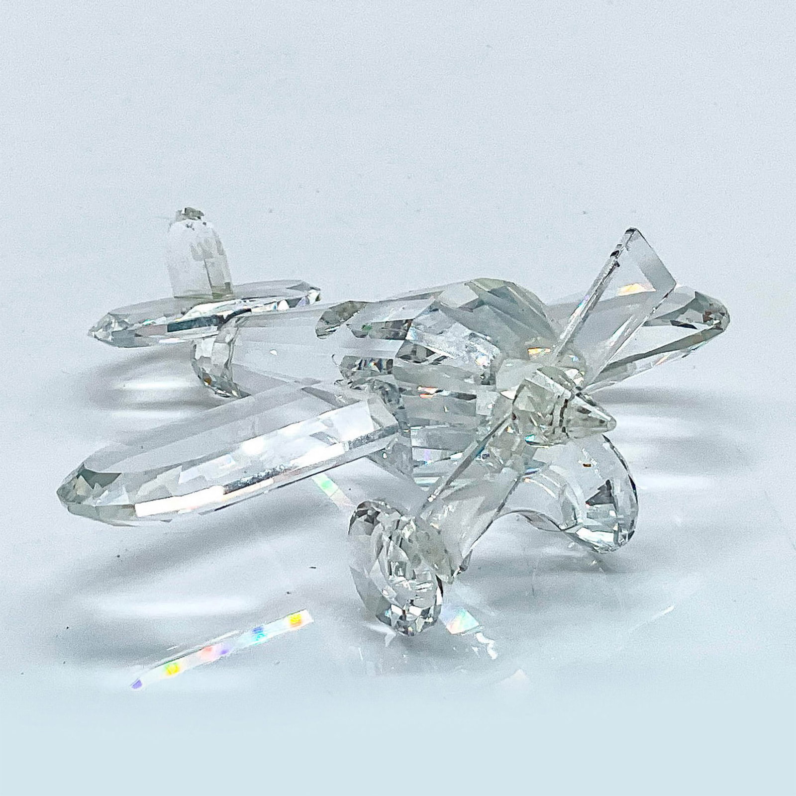 Swarovski Silver Crystal Figurine, Aeroplane: Lead crystal part of the When We Were Young series and is made from clear crystal. Swarovski etched backstamp. This item has its original box. Box measures: 4"W x 4.75"H. Issued: 1990-1999 Dimensions: