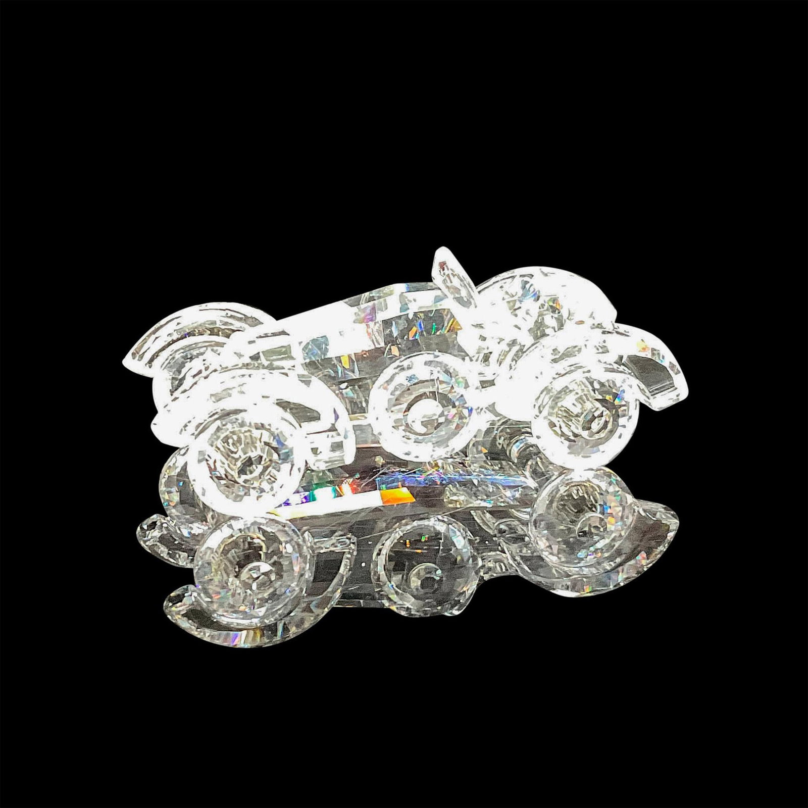 Swarovski Silver Crystal Figurine, Antique Automobile: Designed crystal with intricate detail in this roadster. Swarovski backstamp. 7473 000 001. This item has its original box: 5"H x 3.25"dia. Certificate of Authenticity included. Issued: 20th century D