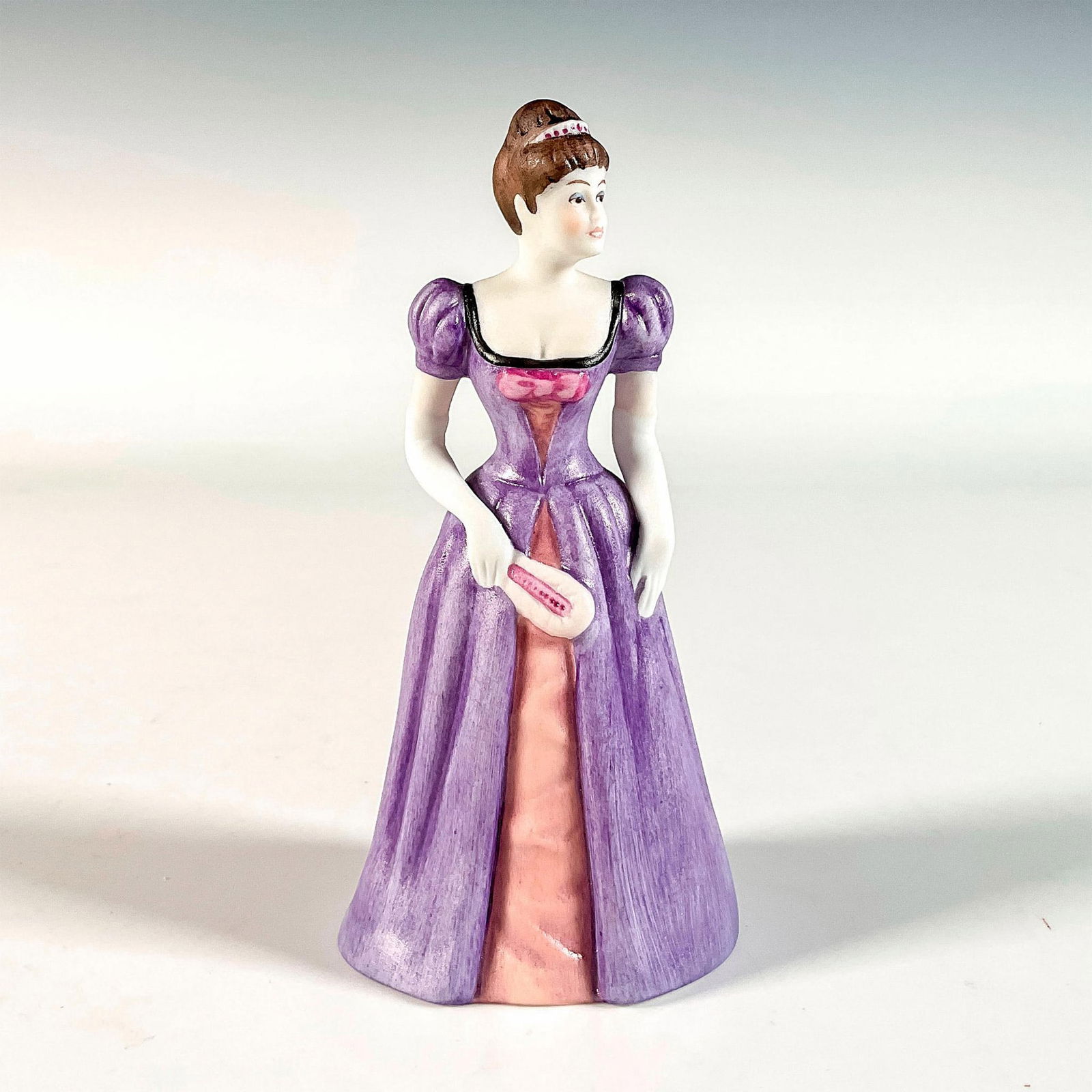 Goebel Porcelain Figurine, Celestine: Hand painted in matte finish depicting a young lady in a nice ball gown with elegant look. Goebel backstamp. This item has its original box. Box measures: 2.25"L x 2.25"W x 5.25"H. Issued: 20th c. Dim