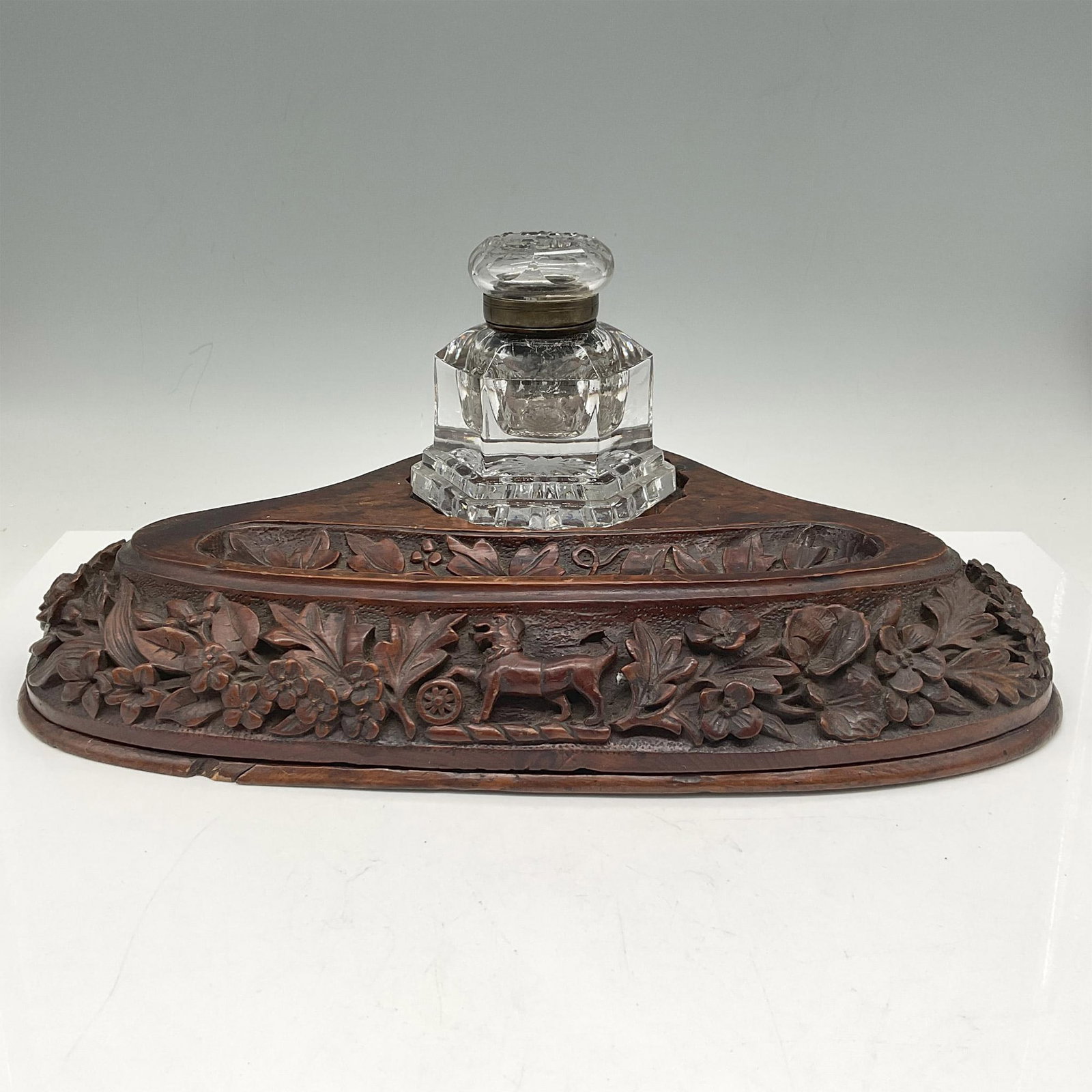 Vintage Carved Wood Pen Tray Desk & Hexagon Crystal Ink Pot: Carved hard wood with a design of florals and animals in triangle tray shape with pen/pencil holder and crystal ink well pot with hinged lid. Issued: 20th century Dimensions: 14"L x 10"W x 6"H
