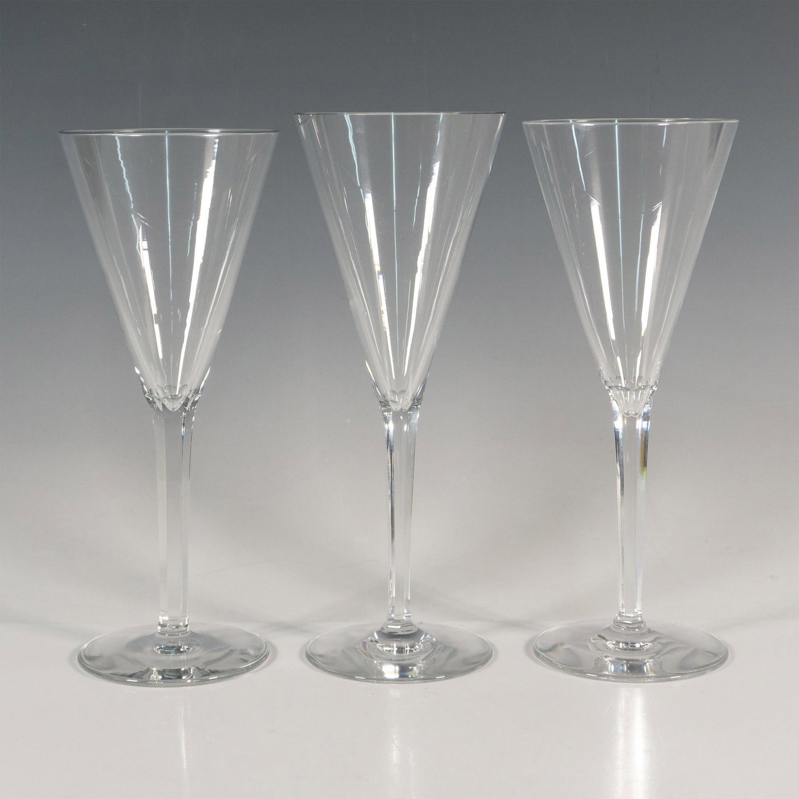 3pc Baccarat Wine Glasses: Inverted cone-shaped bowl complemented by a cut faceted stem. Baccarat acid etched backstamp. Dimensions: 3"L x 3.25"W x 8"H Manufacturer: Baccarat Country of Origin: France