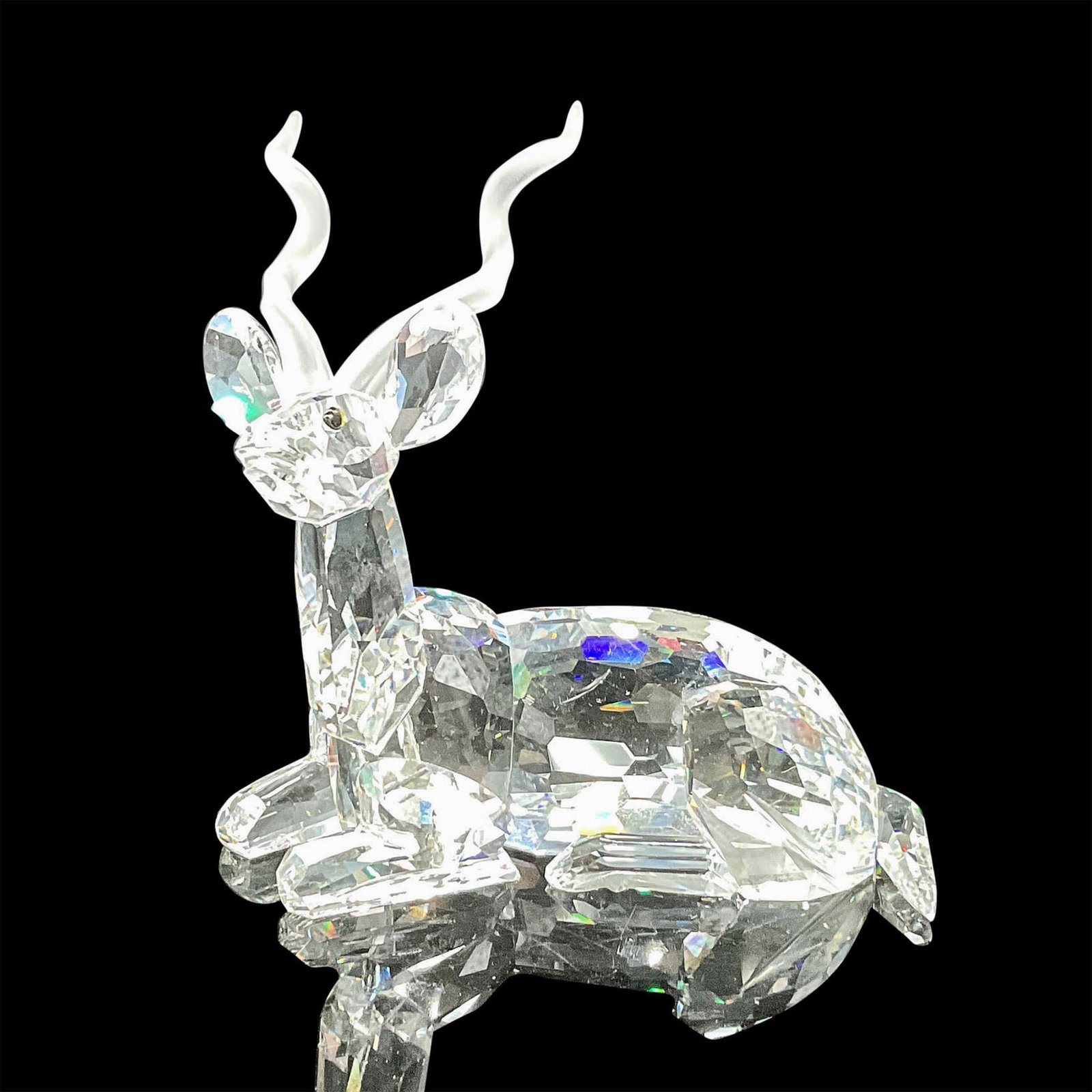 Swarovski Crystal Society Figurine, 1994 Kudu: Annual edition Inspiration Africa figure, created in brilliant clear crystal with jet crystal eyes and satin horns. Swarovski backstamp. 175703. This item has its original box: 7.5"L x 7.5"W x 6.5"H. 