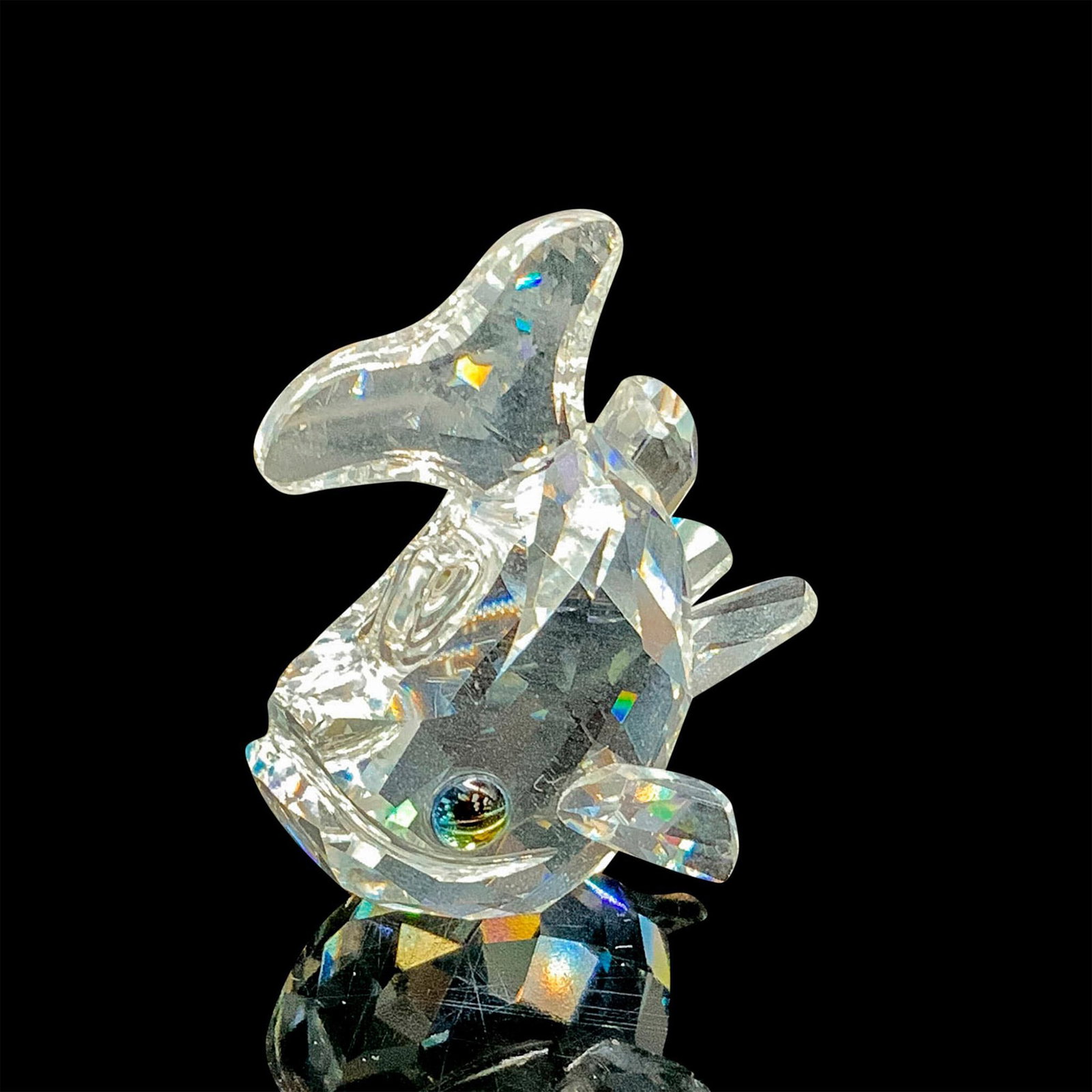 Swarovski Silver Crystal Figurine, Baby Carp 211743: This retired fish figurine has a clear, facetted crystal body. Swarovski acid stamp on the bottom. The box measures 3.25"dia. x 2.5"H. Artist: Michael Stamey Issued: 1997-2001 Dimensions: 1.5"L x 1.25
