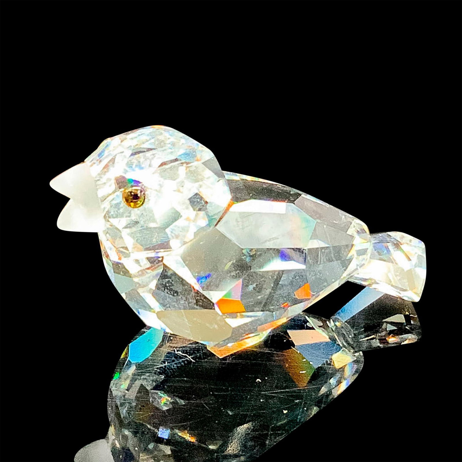 Swarovski Silver Crystal Figurine, Sparrow 169685: This retired Swarovski crystal sparrow bird has a clear faceted crystal body, black eyes, and a frosted beak. Swarovski acid stamp on bottom. The box measures 3.25"dia. x 2.5"H. Artist: Claudia Schnei
