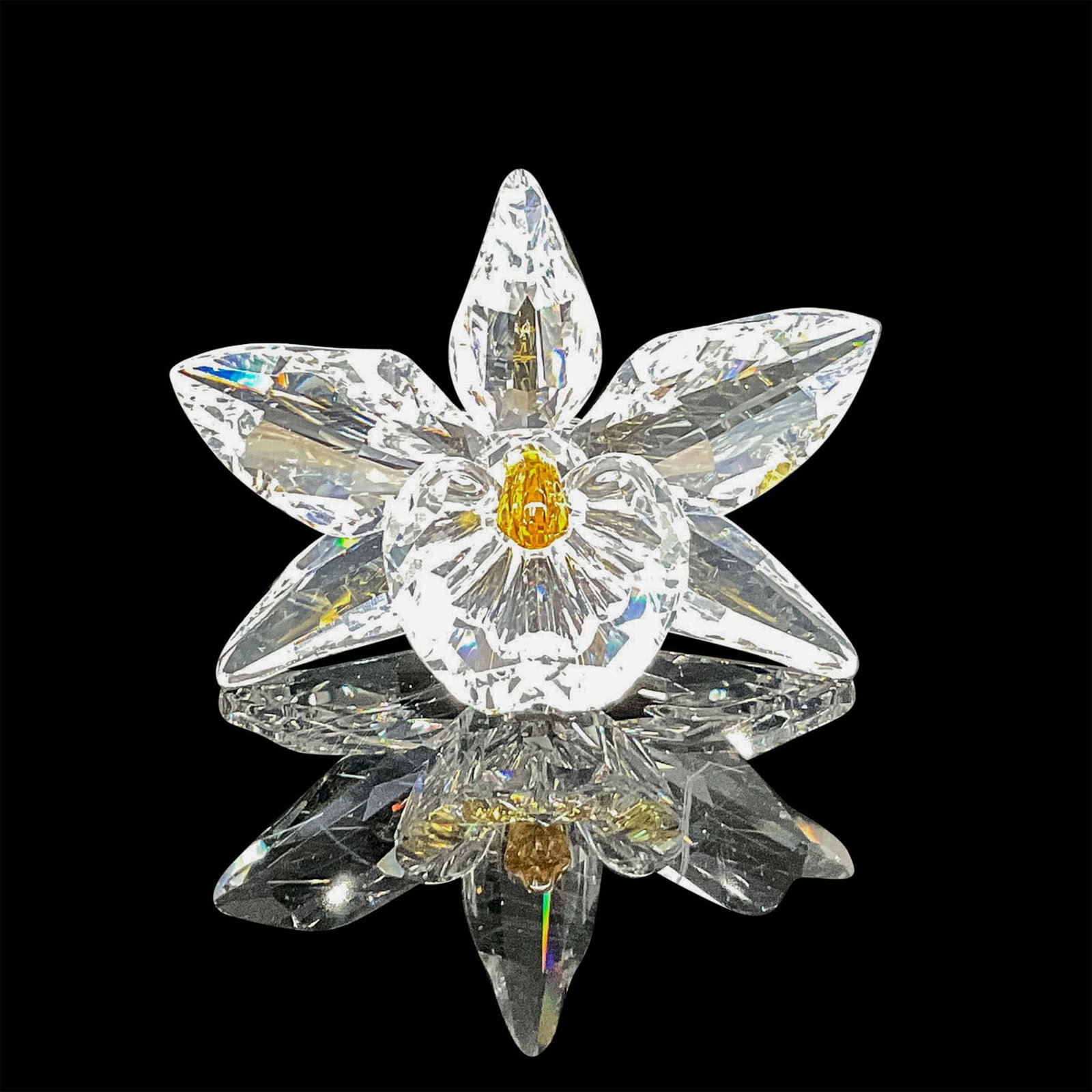 Swarovski Silver Crystal Figurine, The Yellow Orchid: Blossomed floral design in clear faceted crystal with pale yellow center. Swarovski backstamp. 7478 000 003. This item has its original box: 5"H x 6"dia. Certificate of Authenticity included. Artist: 