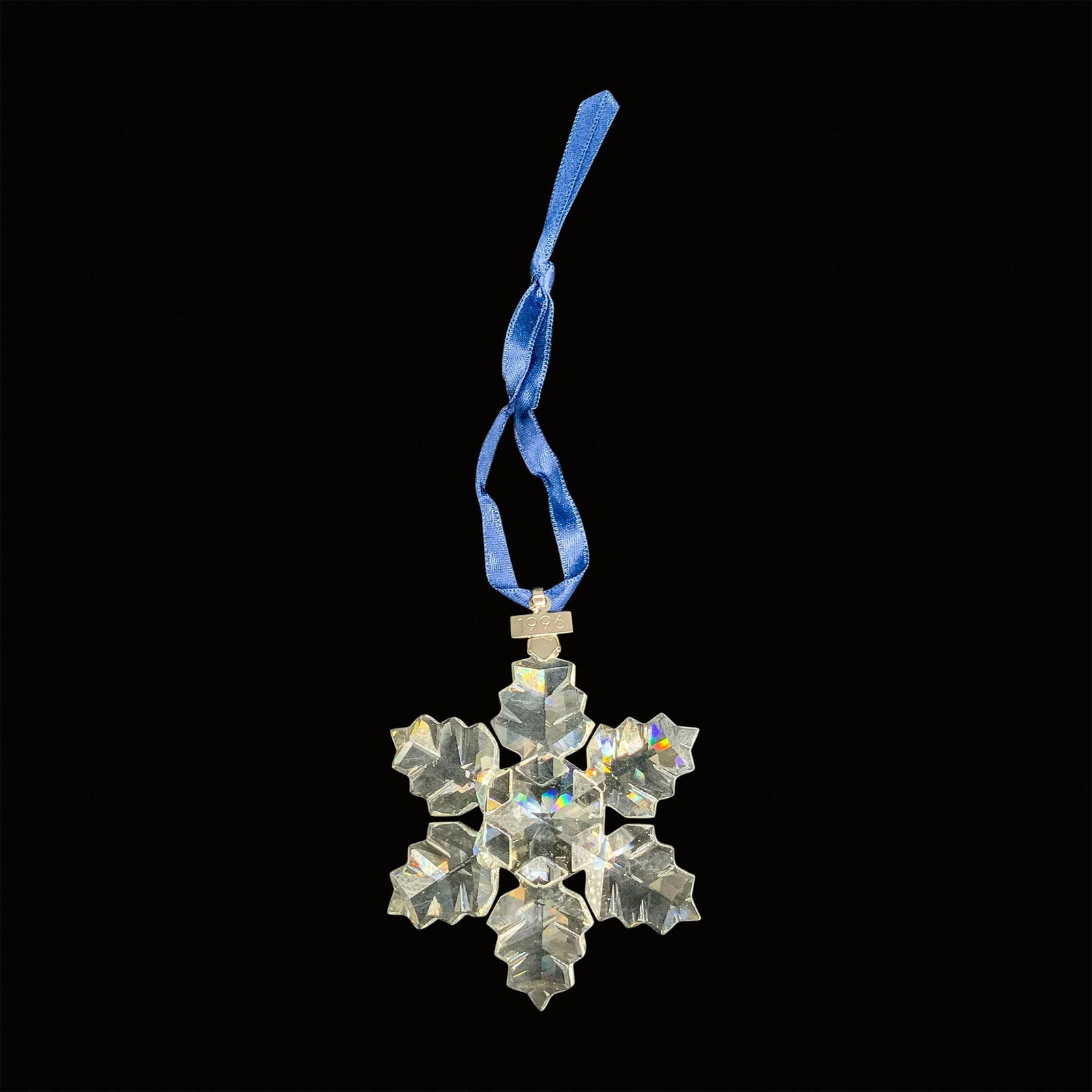 Swarovski Crystal 1996 Annual Christmas Ornament: This retired limited edition Swarovski Christmas tree snowflake ornament is made from clear crystal and has a metal tag with 1996 etched on it. The box is triangular and each side measures 6"L x 1.25"