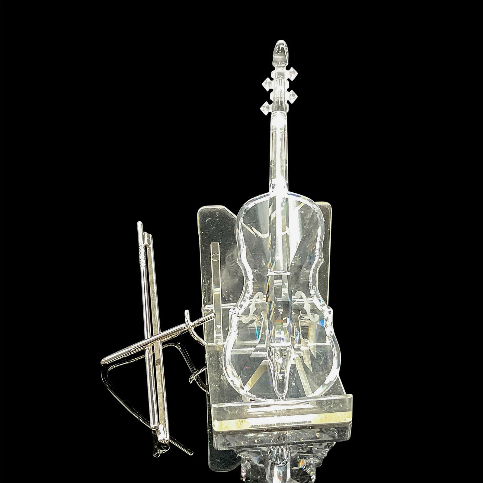 Swarovski Crystal Figure, Violin with Chrome Bow Stand: Designed in clear crystal with shiny chrome bow stand. Swarovski backstamp. This item has its original box: 6"H x 3"dia. Certificate of Authenticity included. Issued: 20th century Dimensions: 1.5"L x