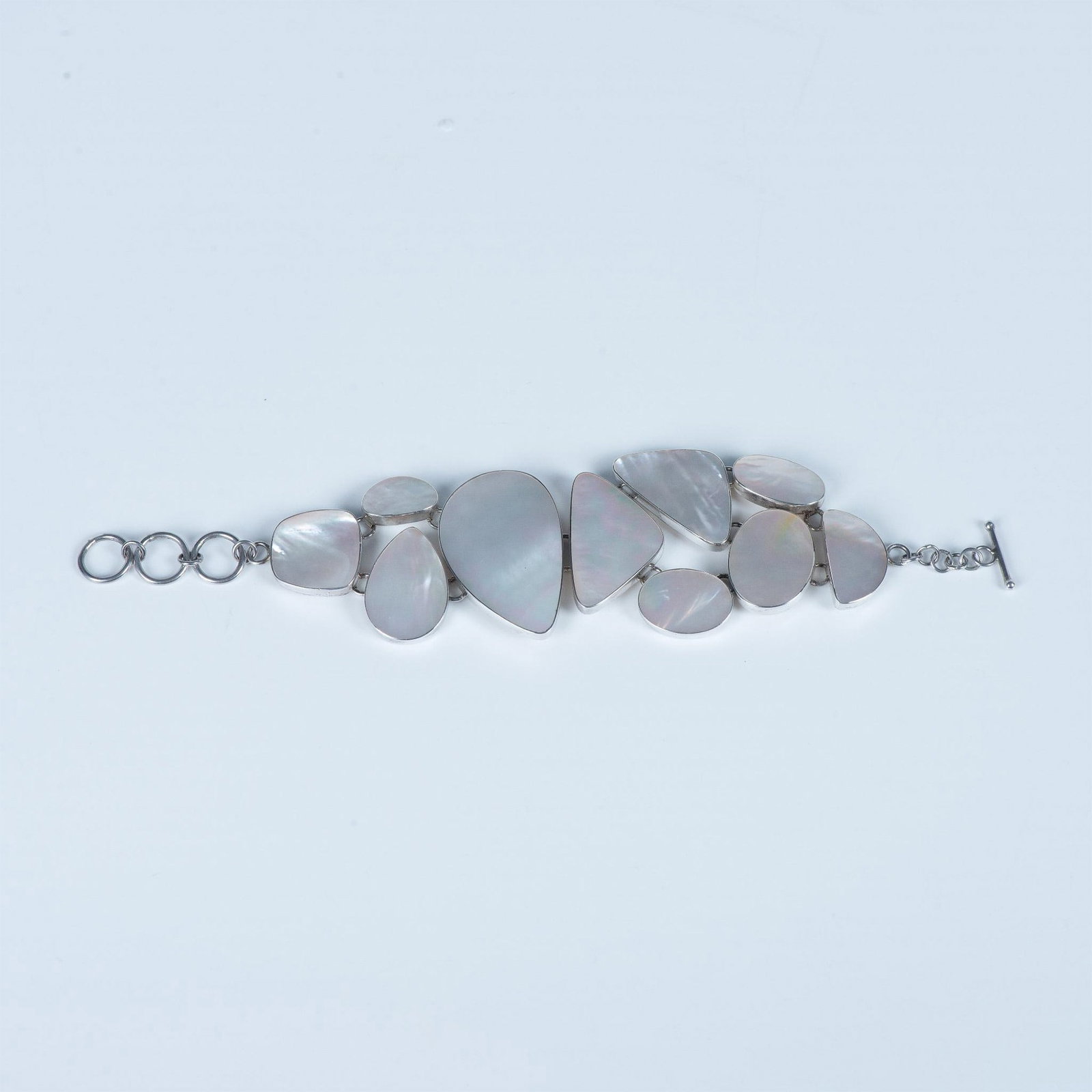 Bold Geometric Sterling Silver & Mother of Pearl Bracelet: Unique bracelet with a toggle clasp stamped 925 on the back of one of the links. It measures 7.5"L end to end, but can be adjusted shorter. 32g.