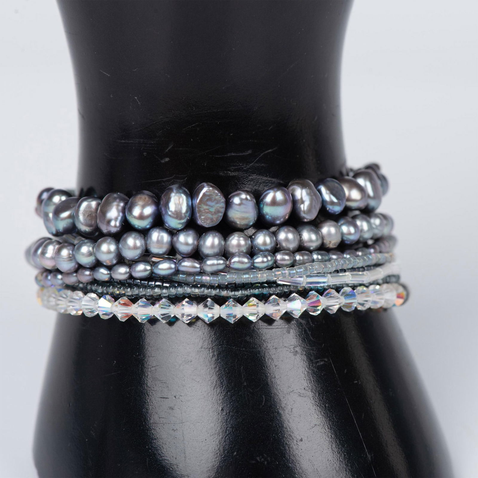 8pc Beautiful Set of Blue Baroque Pearl and Bead Bracelets: 3 of the bracelets are genuine blue pearls of different sizes, and 5 of them are blue and iridescent beads that accent the pearls. All bracelets are on elastic bands that stretch. Measures 2.75" witho