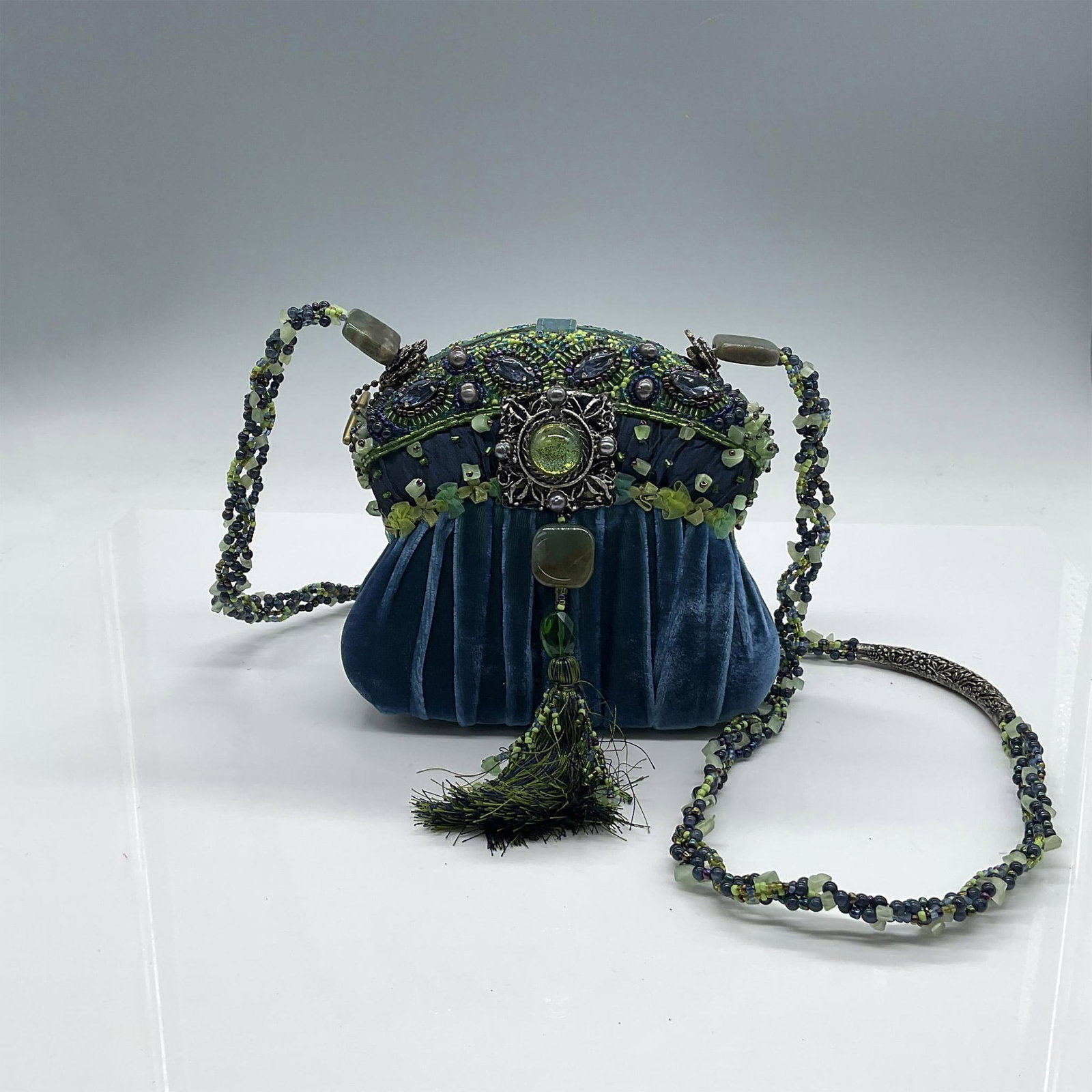 Mary Frances Box Velvet and Beaded Handbag: This is a beautiful little evening bag. Covered in gathered blue velvet and satin with a piping of blue and green decorative ribbon. The top portion of the bag is blue, green and purple seed and bugle