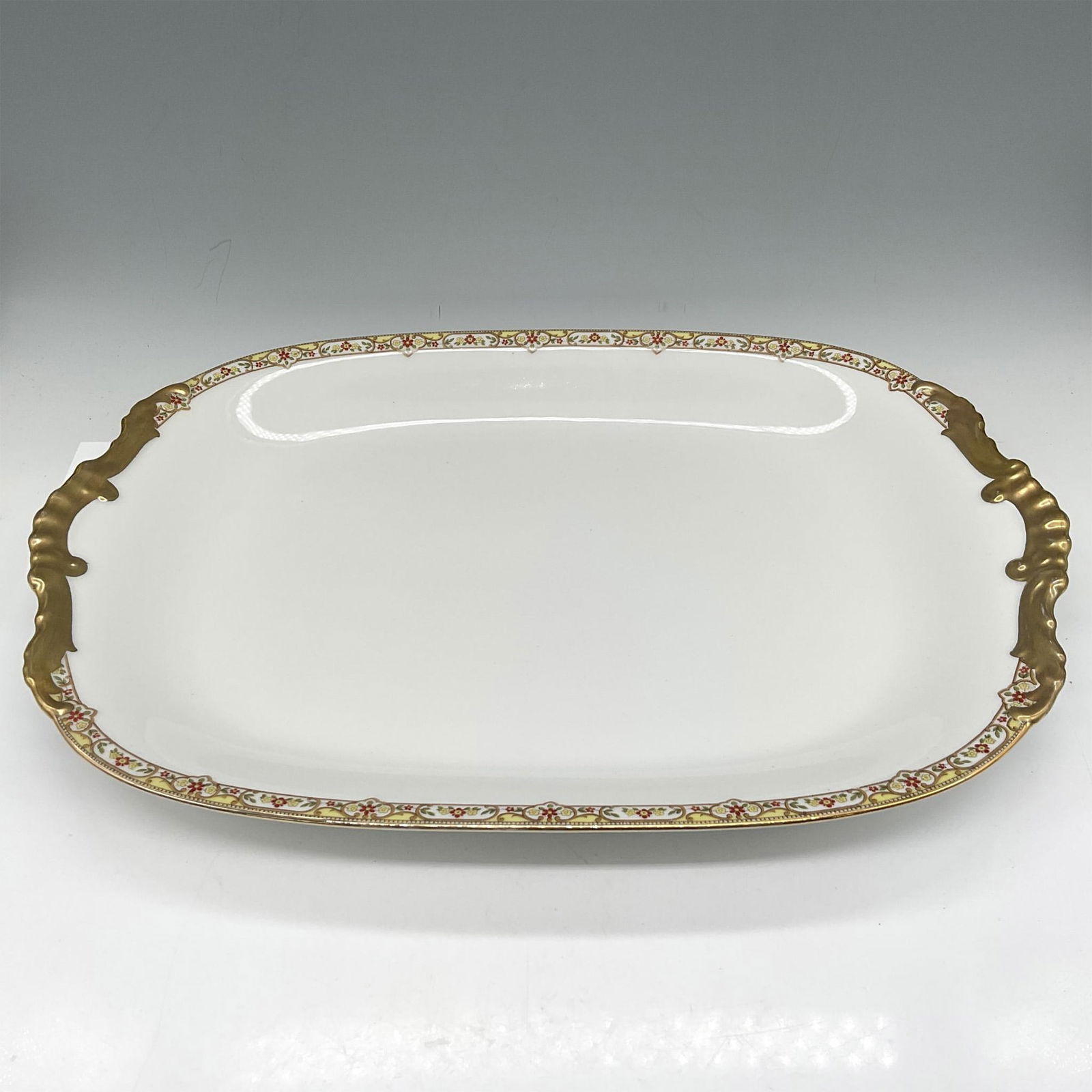 Limoges Vignaud Porcelain Serveware, Large Oval Platter: This elegant gilt banded design of red and yellow floral pattern was originally produced for the Frederick Loeser & Co. of Brooklyn. Limoges Vignaud France Loeser's backstamp. VIG167. Issued: c. 1911
