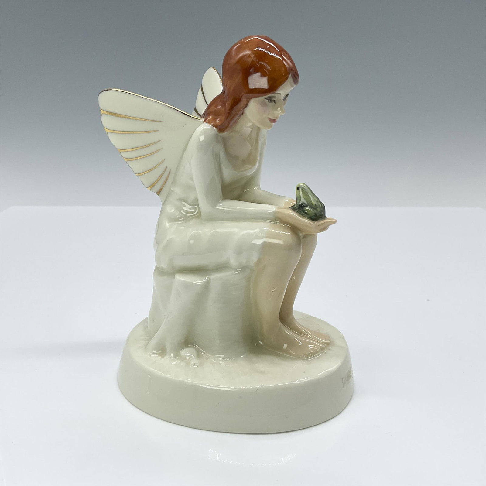 Fairyspell - HN2979 - Royal Doulton Figurine: Artist: Amanda Hughes Issued: 1983 - 1986 Dimensions: 5.25"H Manufacturer: Royal Doulton Country of Origin: England