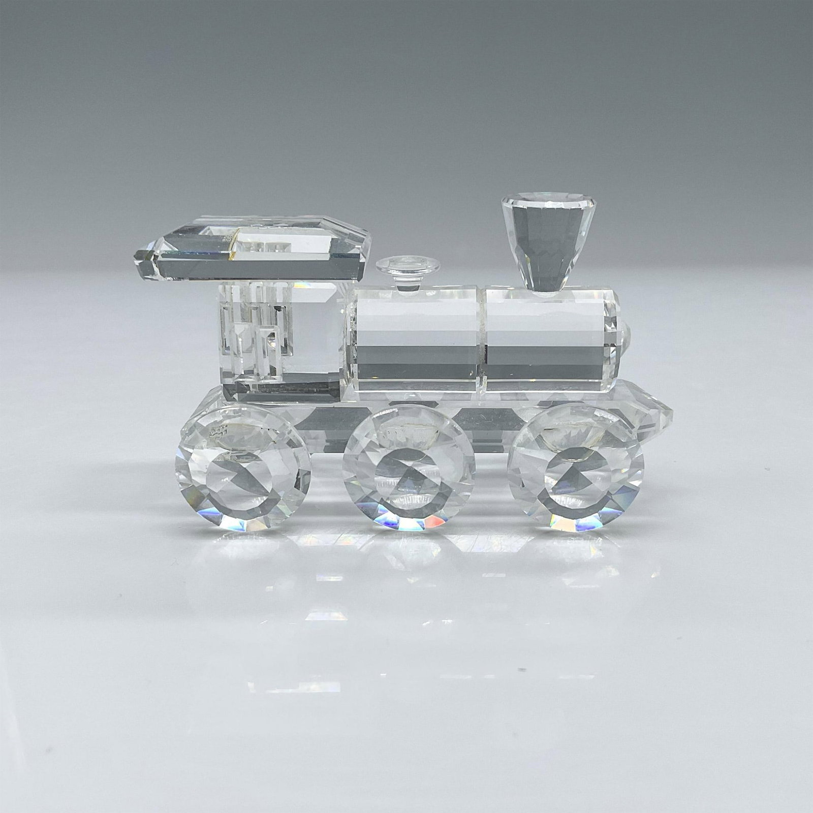 Swarovski Silver Crystal Figurine, Locomotive: Lead crystal train, which was one of the six pieces of the Silver Crystal Express which belong to the When We Were Young collection. Swarovski etched backstamp. This item has its original box which me