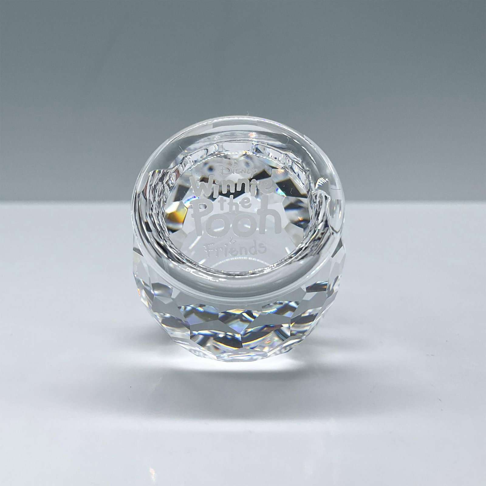 Swarovski Crystal Figurine, Winnie The Pooh Plaque: Clear crystal barrel with inscription: Disney Winnie the Pooh & Friends. Includes certificate and the original box, dimensions: 5''H x 3.25''dia. Swarovski etched backstamp. Issued: 20th century Dimen