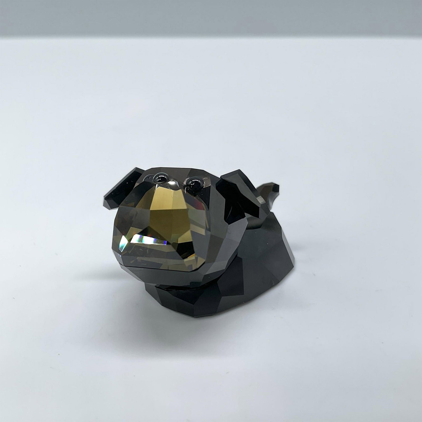 Swarovski Crystal Figurine, Tomasino: Lead Smokey Quartz crystal bulldog from the Lovlots Gang of Dogs collection. Includes certificate and the original box, dimensions: 2.5"H x 3.25"dia. Swarovski etched backstamp. Issued: 20th century D