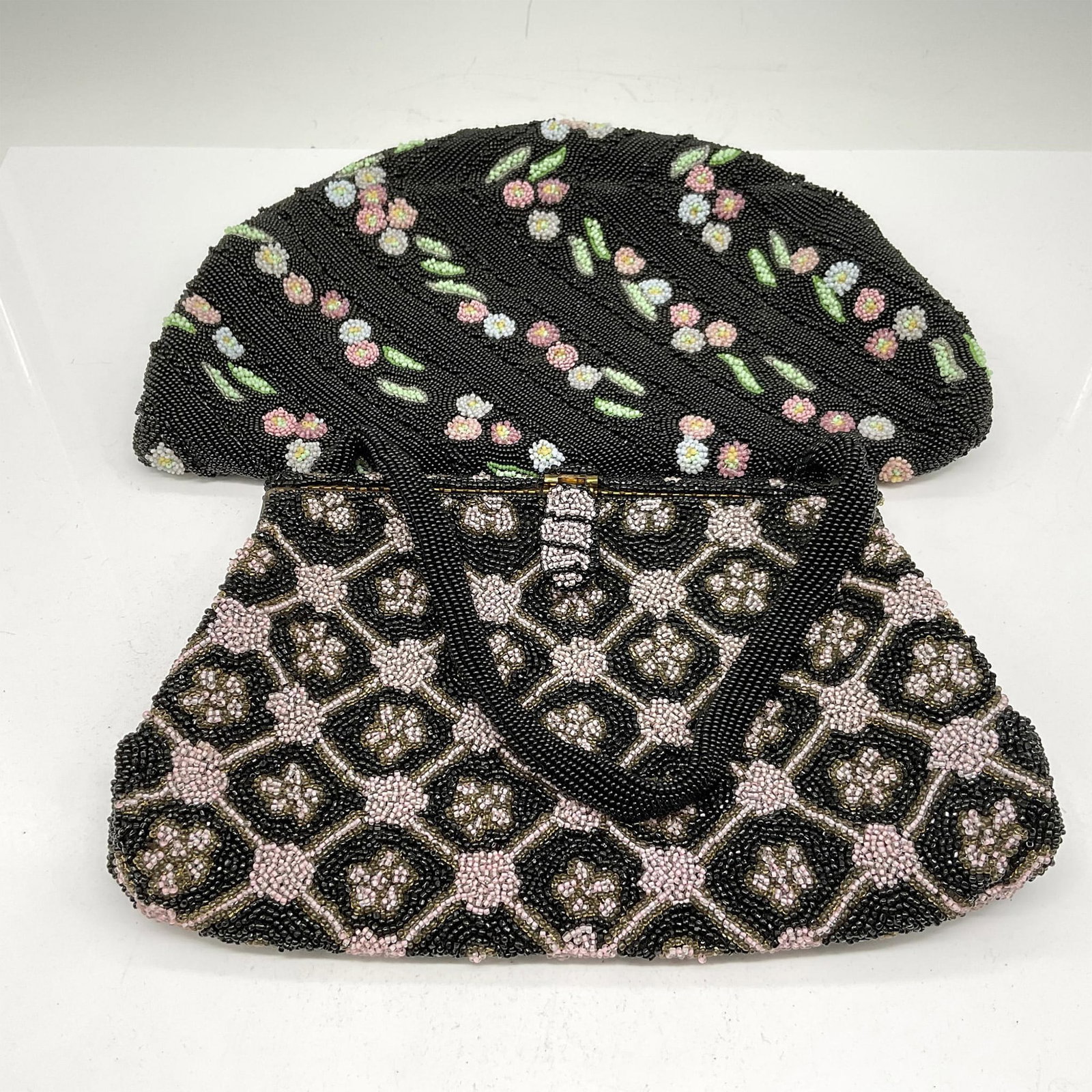 Koret Tresor and Franklin Simon Beaded Bags: Half-moon black and multicolored beaded bag with twist closure opens to satin lined interior. Koret Tresor tag. Black with pink beads creates this handled bag. Franklin Simon tag. Issued: 20th century