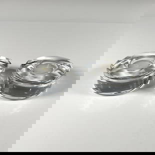 2pc Orrefors Crystal Candleholders, Puck: Circular clear thick crystal duo, each include tealights, their certificates and the original boxes, dimensions: 4''L x 4''W x 2''H. Orrefors etched backstamp. Artist: Lena Bergstrom Dimensions: 1.5''
