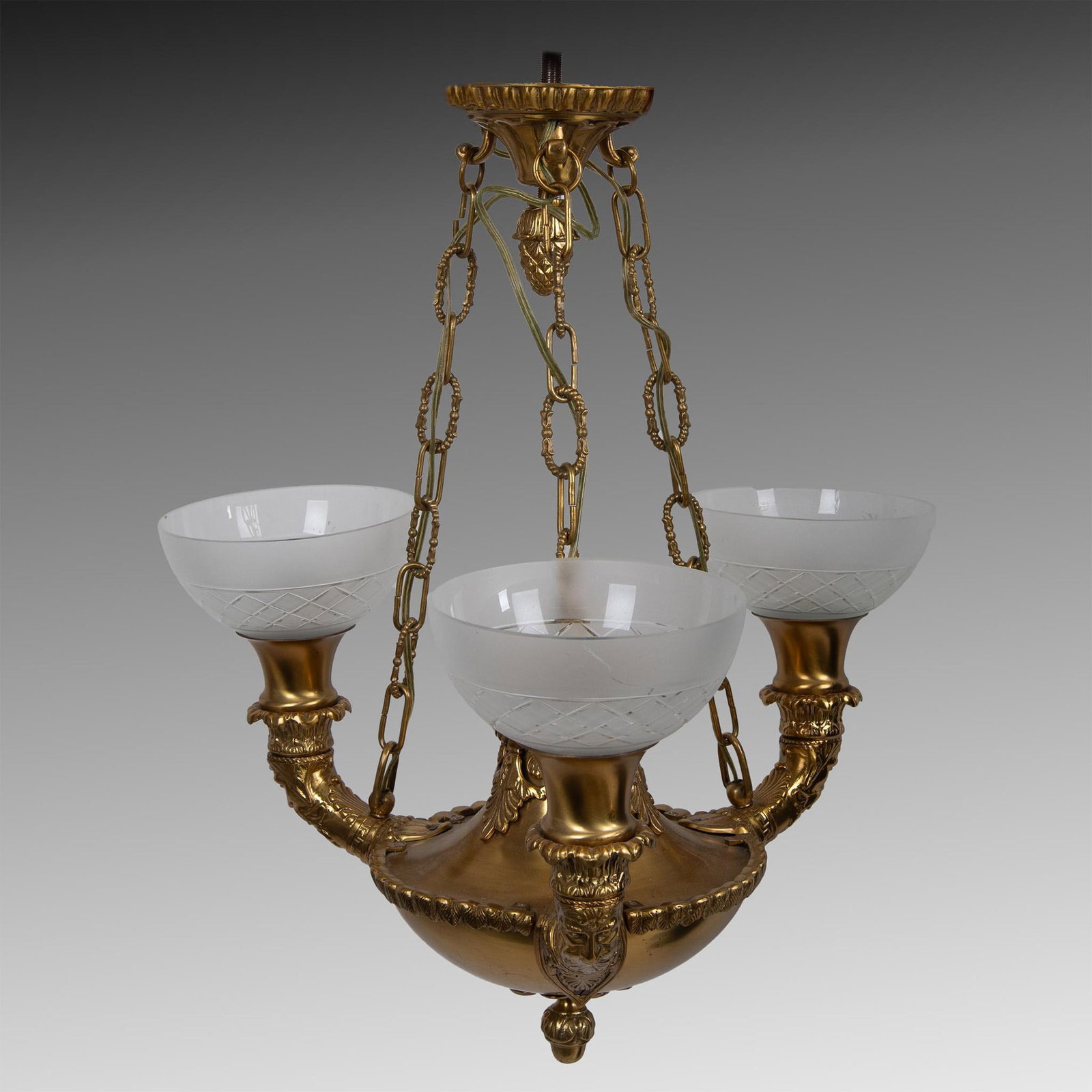 Vintage Gilded Baroque Style Chandelier: A stunningly beautiful gold-tone metal light with three extended arms to hold frosted glass shades. Each arm features a long bearded man. The center has acanths leaves and acorn finials. Dimensions: 2