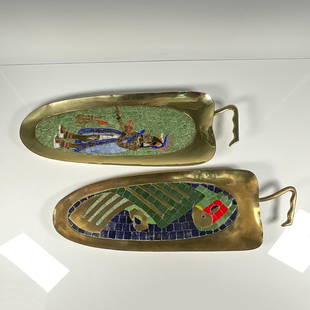 Pair of Salvador Teran Style Mosaic Trays: A set of 2 brass trays featuring in glass mosaic inlay a parrot on one, and a figure on the other. Handwrought and Hecho en Mexico marked on one of the trays. Parrot: 23.5"L x 7.75"W x 1"H. Figure: