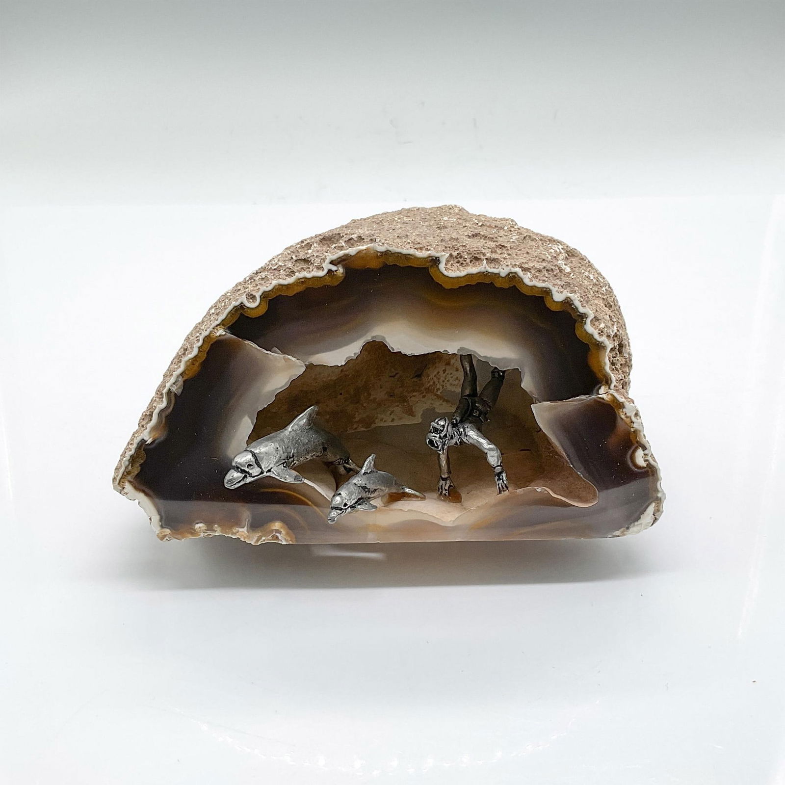 Geode Diorama Underwater Cave: Geode diorama of an underwater cave scene with a scuba diver and 2 dolphins. Issued: 21st century Dimensions: 6.25"L x 4.25"W x 3.25"H