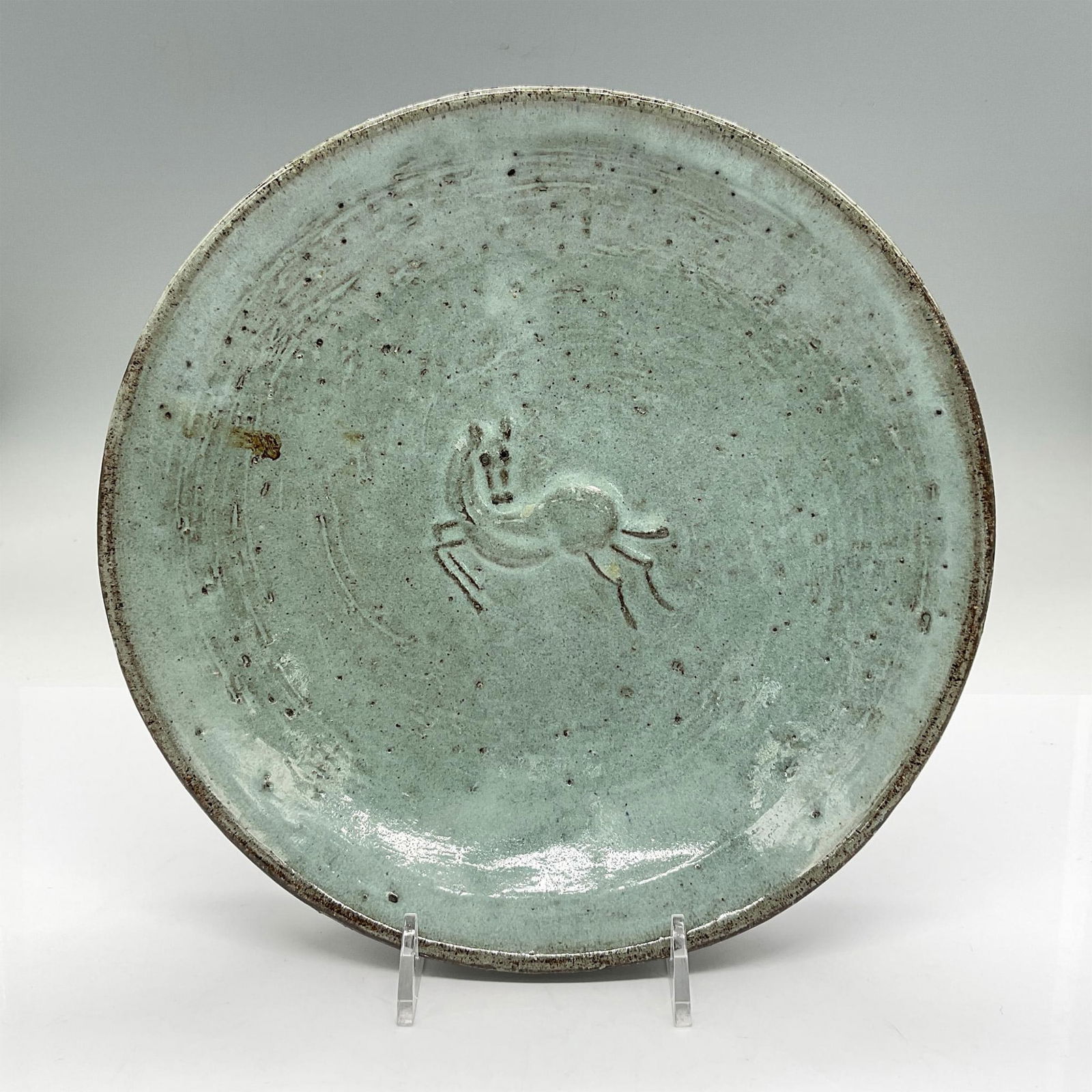 Eugene Deutch (1904-1959) Pottery Bowl, Horse: Thick earthenware bowl with horse in the middle in low-relief. Glazed in light blue and brown. Signed E. Deutch. Artist: Eugene Deutch Issued: 1952 Dimensions: 1.75"H x 8.5" dia