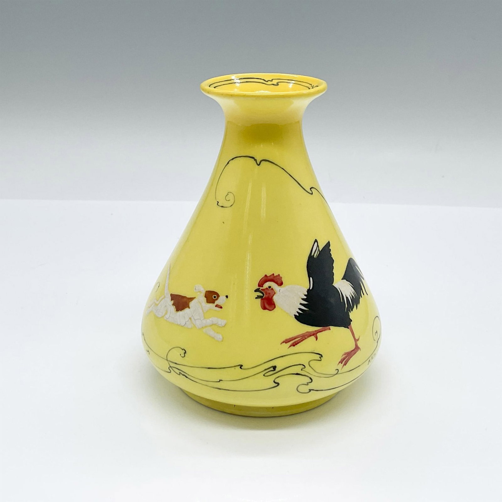 Royal Doulton Arthur Eaton Porcelain Vase: An Erlenmeyer flask formed yellow ground vase featuring a hand painted scene of a terrier and a rooster in conflict. Signed by artist on the body. Royal Doulton backstamp. Artist: Arthur Eaton Issued: