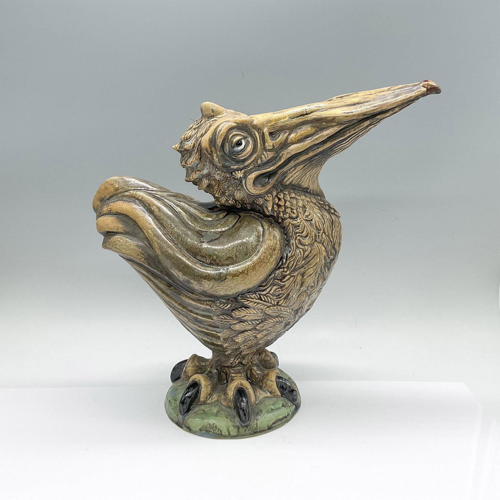 Andrew Hull for Cobridge Stoneware Grotesque Figure, Albert: Stoneware grotesque figure of a pelican bird. Green and tan coloration. Excellent carved details on the feathers and legs. Cobridge Stoneware impressed stamp on the underside. Artist: Andrew Hull Issu