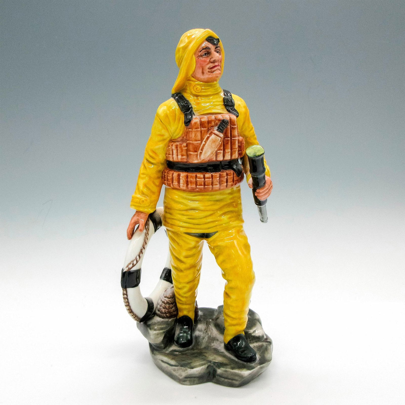 Lifeboat Man HN2764 - Royal Doulton Figurine: Glossy finish. Royal Doulton backstamp. Artist: William K. Harper Issued: 1987 - 1991 Dimensions: 9.25"H Manufacturer: Royal Doulton Country of Origin: England