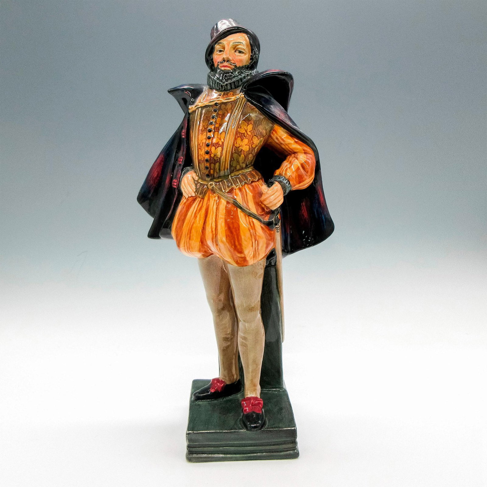 Sir Walter Raleigh HN2015 - Royal Doulton Figurine: Glossy finish. Royal Doulton backstamp. Artist: Leslie Harradine Issued: 1948 - 1955 Dimensions: 11.5"H Manufacturer: Royal Doulton Country of Origin: England