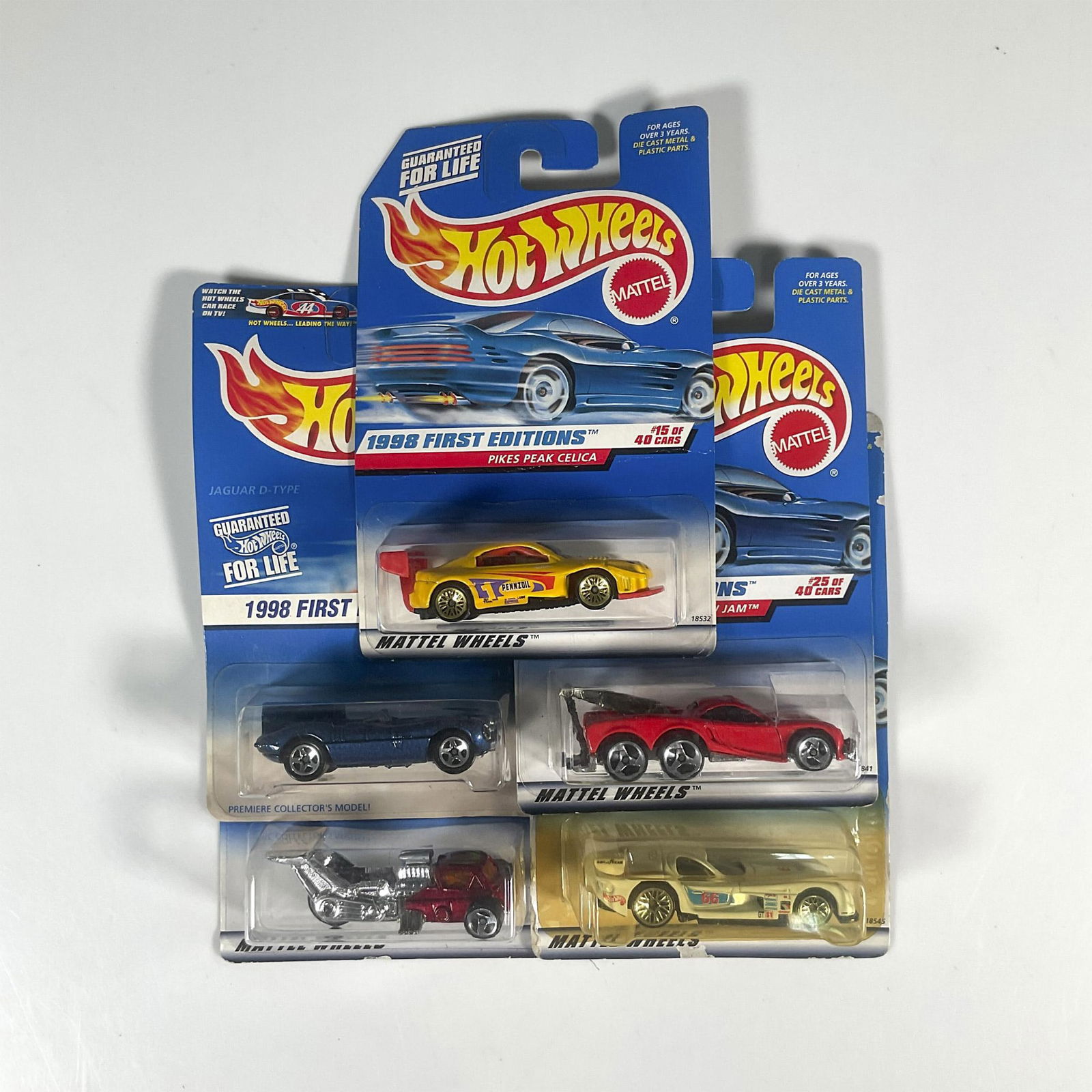 5pc 1998 First Ed. Hot Wheels Toy Cars: A set of 5 hot wheels toy car that consist of the Pike Peak Celica (15 of 40), the Panoz GTR-1 (19 of 40), the Tow Jam (25 of 40), the Jaguar D-Type (6 of 48), and the Whatta Drag (36 of 40). Marked 1