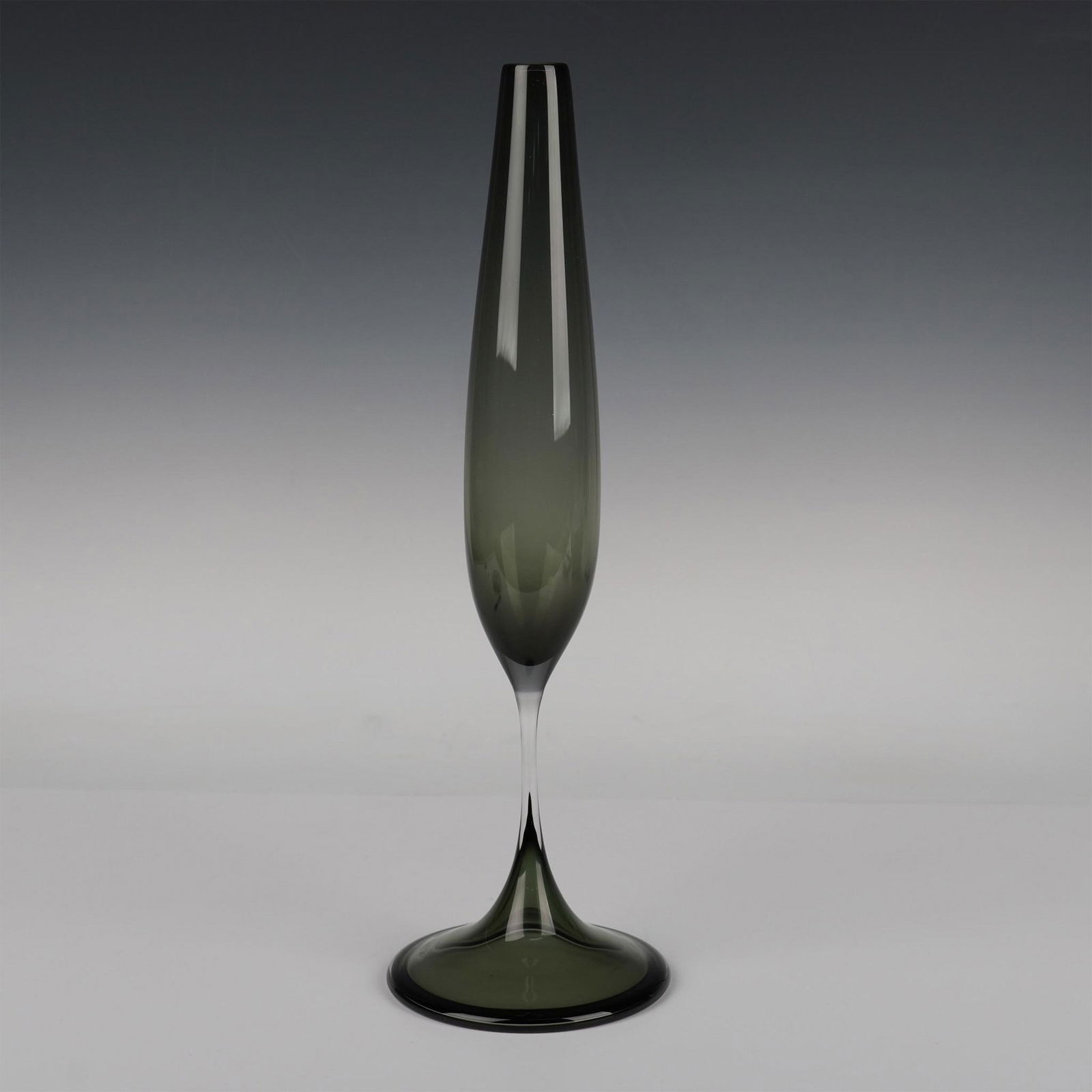 Orrefors by Nils Landberg Tulpan Vase: Dark green glass with a flared base and a slender oblong formed top. Orrefors Expo etched on the base. Artist: Nils Landberg Issued: 1950s Dimensions: 5.25"W x 16.25"H Manufacturer: Orrefors Country