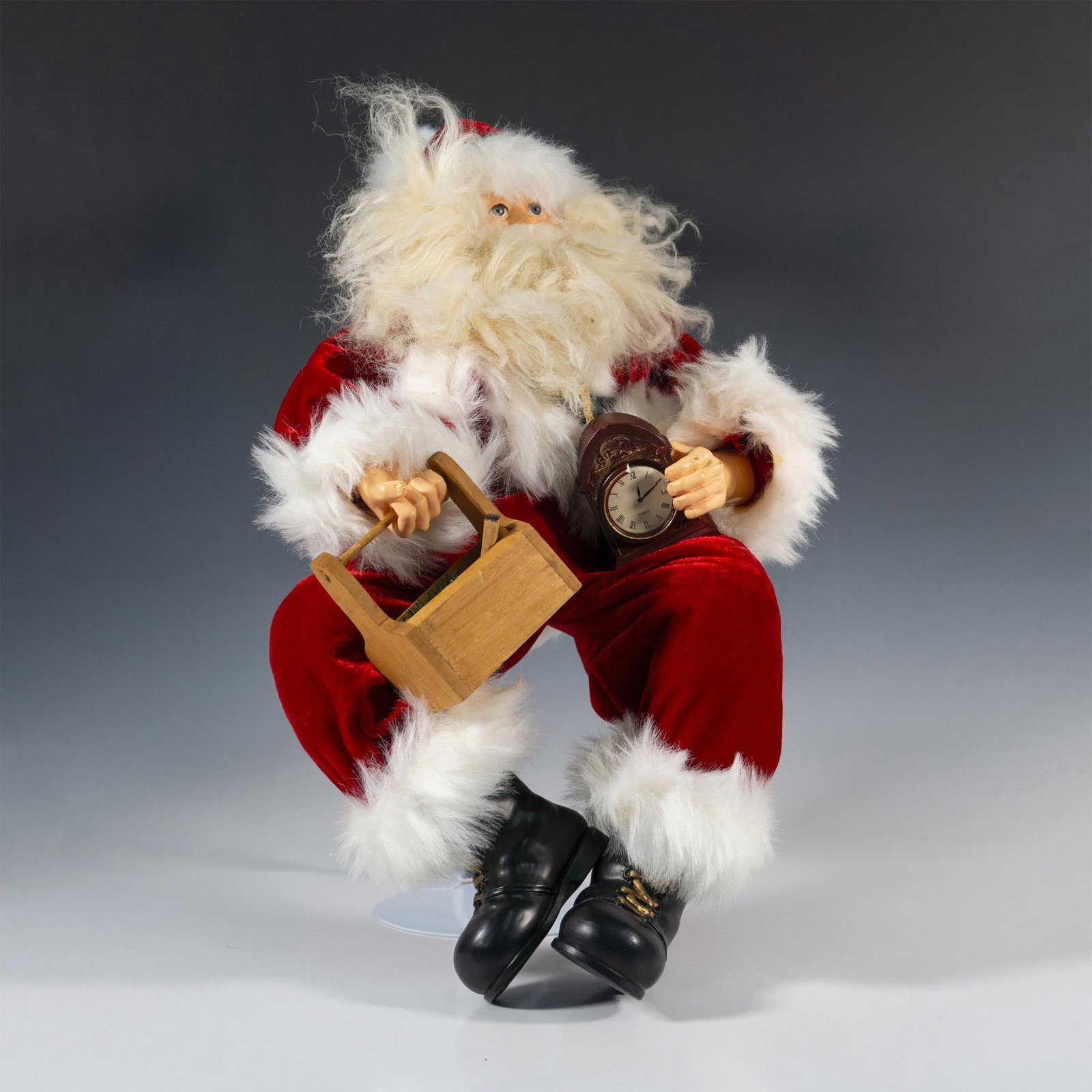 Sitting Santa, Waiting for the Time: Dressed in his thick red suit with fur lined hat and wild, long beard he is ready to start his job. Holding a clock in one hand and box in the other. Issued: 20th century Dimensions: 10"L x 9"W x 20"H