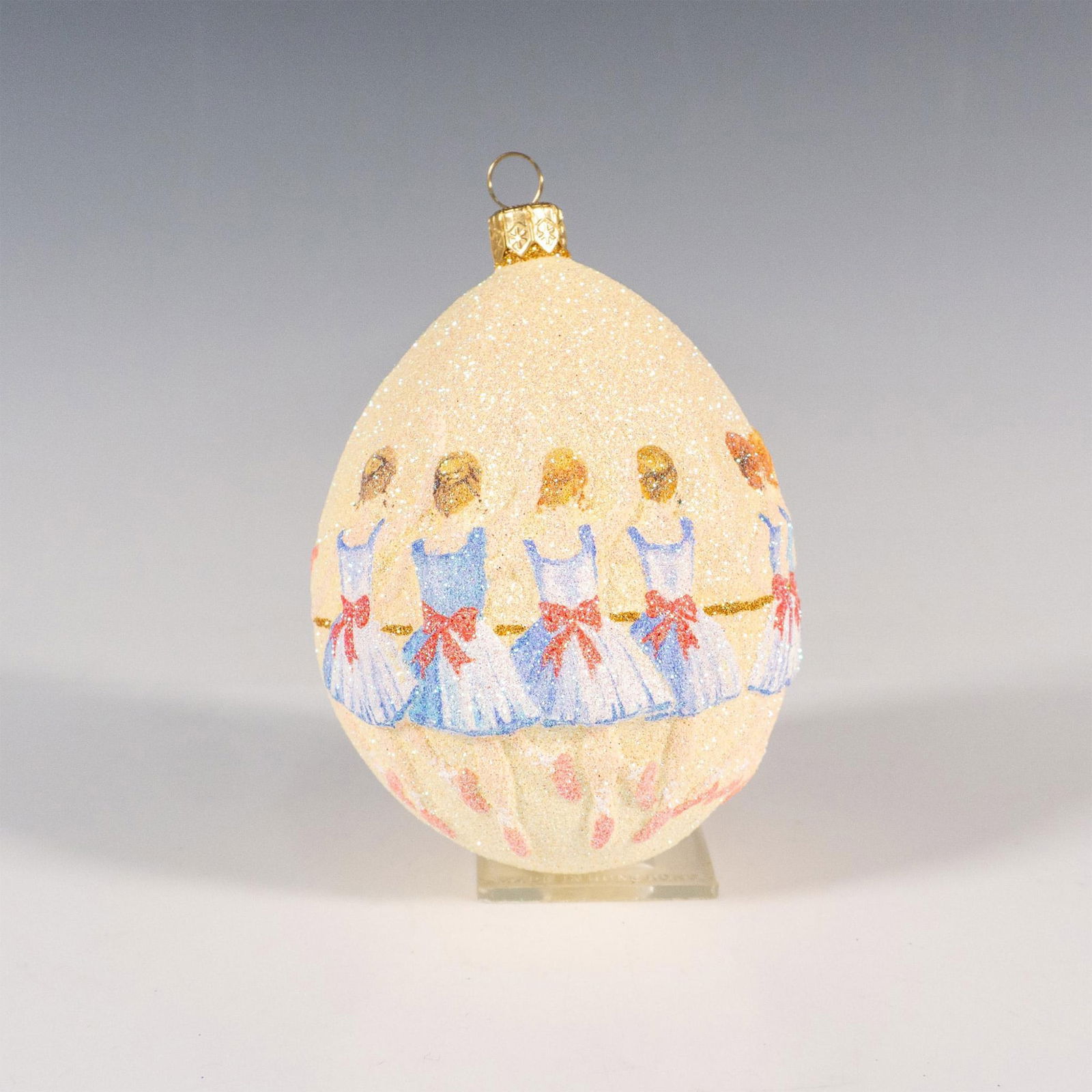 Patricia Breen Christmas Ornament, Nine Ladies Dancing: Elegantly crafted, this egg-shaped ornament is adorned with glitter and hand-painted to depict graceful ladies at a ballet barre. This is part of the 12 Days of Christmas series. Also Known as Ladies
