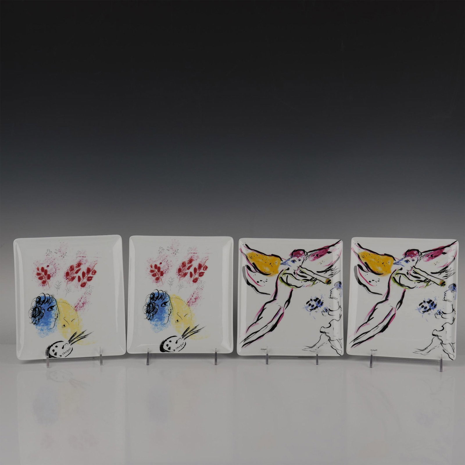 4pc Marc Chagall by Bernardaud Plates Double Face & Red Angel: This beautiful set of rectangular trays are made of fine Limoges porcelain, part of the Marc Chagall Collection by Bernardaud, features two pairs of arts: L Ange Rouge or Sketch for Red Angel, model f
