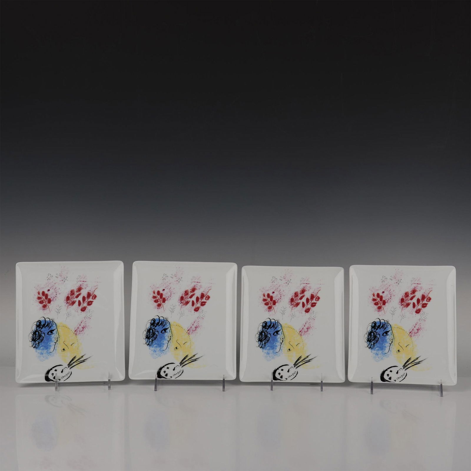 4pc Marc Chagall by Bernardaud Plates, Double Face: This stunning set of rectangular trays are made of fine Limoges porcelain, part of the Marc Chagall Collection by Bernardaud, features the art: Double Visage Bleu et Jaune du Peintre which traduces to
