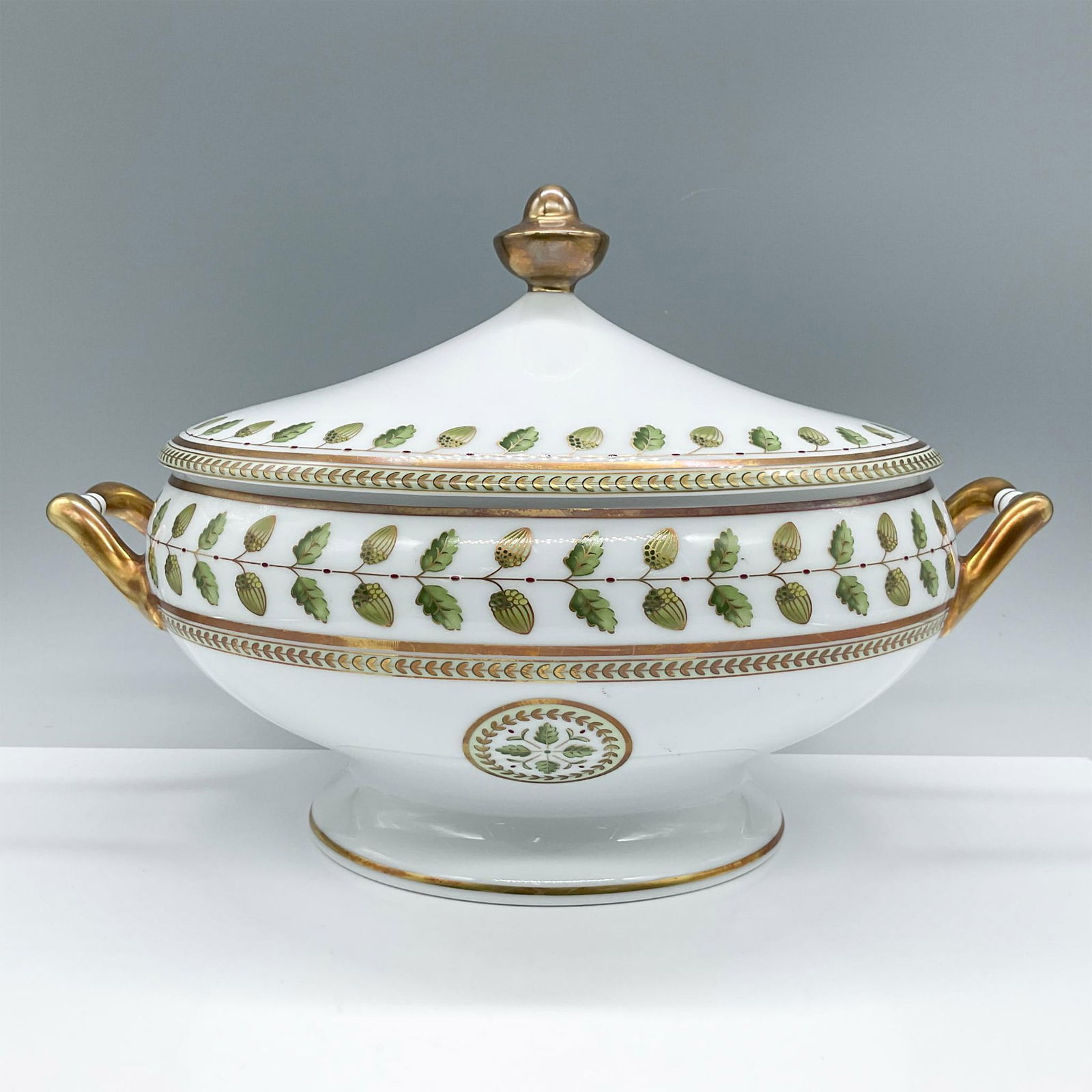 Bernardaud Porcelain Covered Soup Tureen, Constance: This beautiful footed porcelain bowl is are artfully arranged and delicate painted with acorns, oak, and laurel leaves symbols of strength, longevity, and peace, giving the impression of being painted