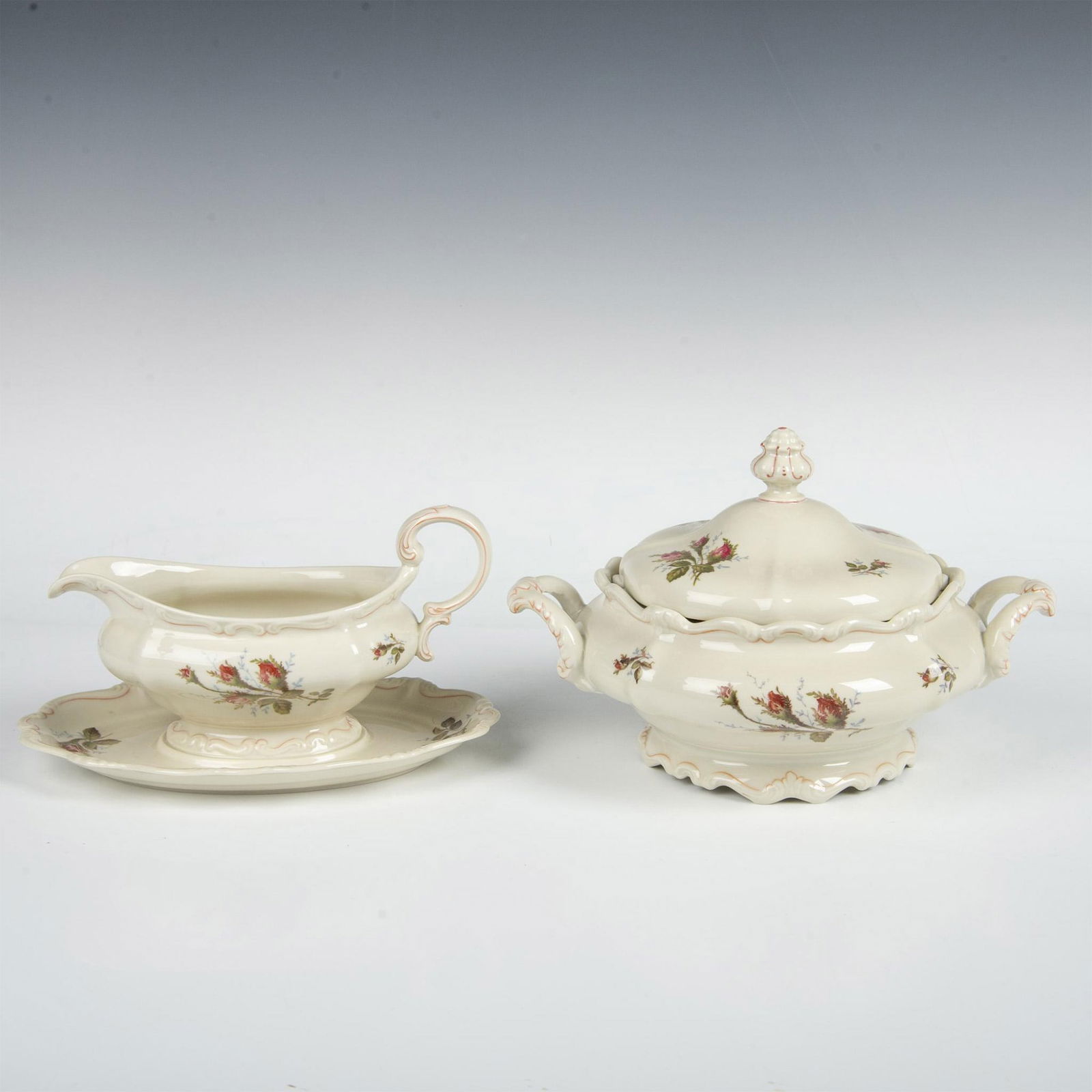 2pc Rosenthal Pompadour Moss Rose Gravy Boat & Tureen: Rosenthal Selb-Germany ivory-tone serveware with images of rose flowers. The gravy boat has an attached plate and measures 10"L x 6.5"W x 5.25"H. The covered serving bowl with handles measures 11"L x