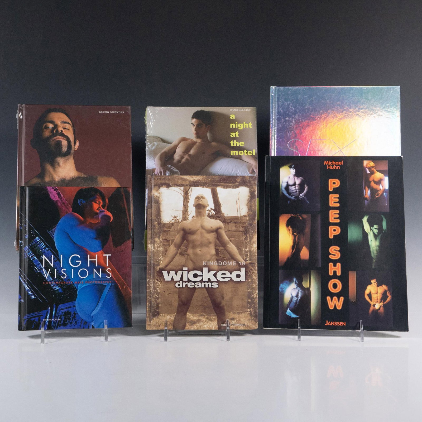 6 Books of Male Erotic Photography: An array of photographic art books of male models in nude and seminude poses in various settings. Titles includes Night Visions : Contemporary Male Photography (Bruno Gmunder, 2008); Wicked Dreams (Ki