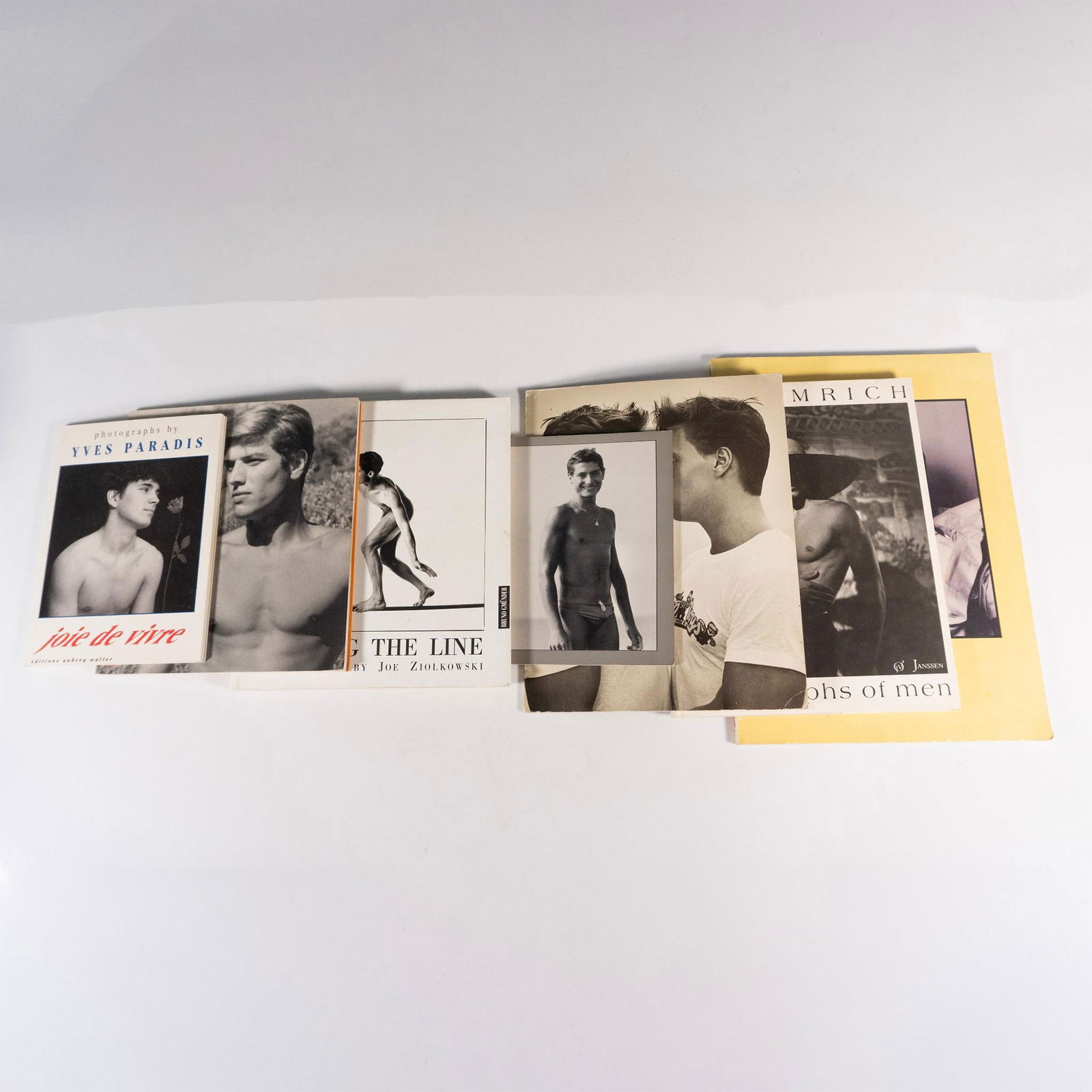 7 Books of Vintage Male Erotic Photography: An array of black and white photography art books of male models. Titles includes Joie De Vivre: Photographs by Yves Paradis (Aubrey Walter, 1991); Kouros: The Male Photographer of John S. Barrington