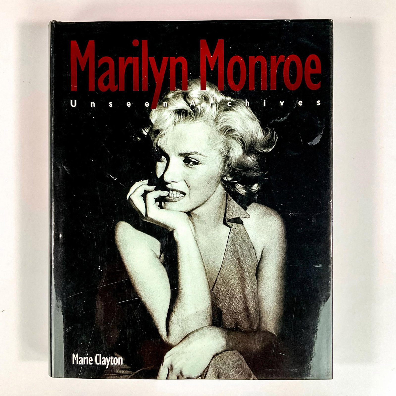 Marilyn Monroe Unseen Archives Book: A 383-page hardcover book exploring the life story of Marilyn Monroe in great detail with hundreds of black and white photos of her and moments of her life. Artist: Marie Clayton Issued: 2004 Dimensio
