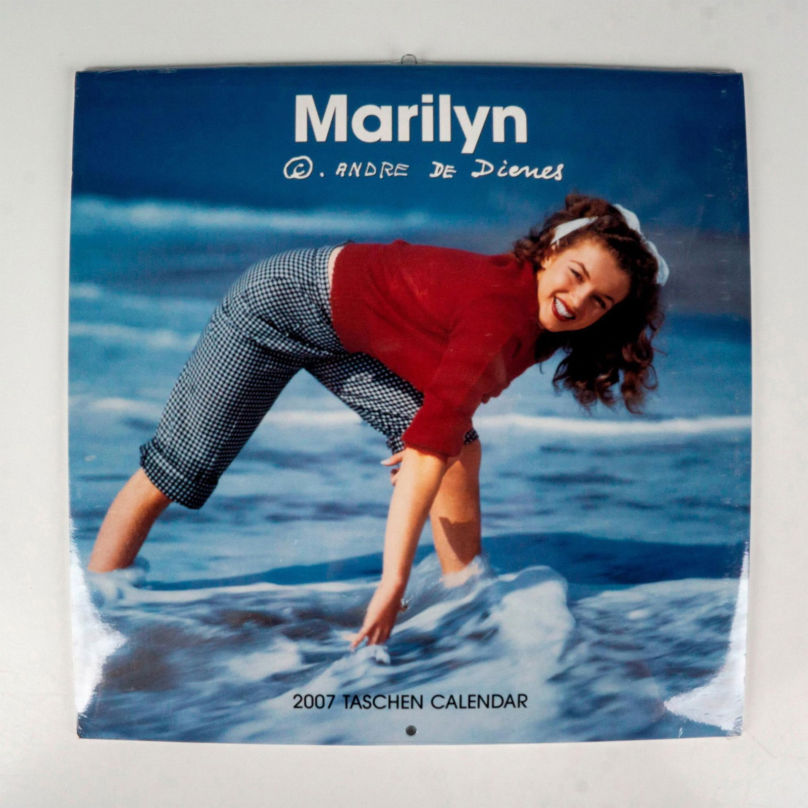 Taschen Calendar, Marilyn by Andre de Dienes 2007: Twelve month calendar depicting color and black and white photographs of American actress Marilyn Monroe. Includes early photographs when she was known as Norma Jeane. Photographs taken by friend and