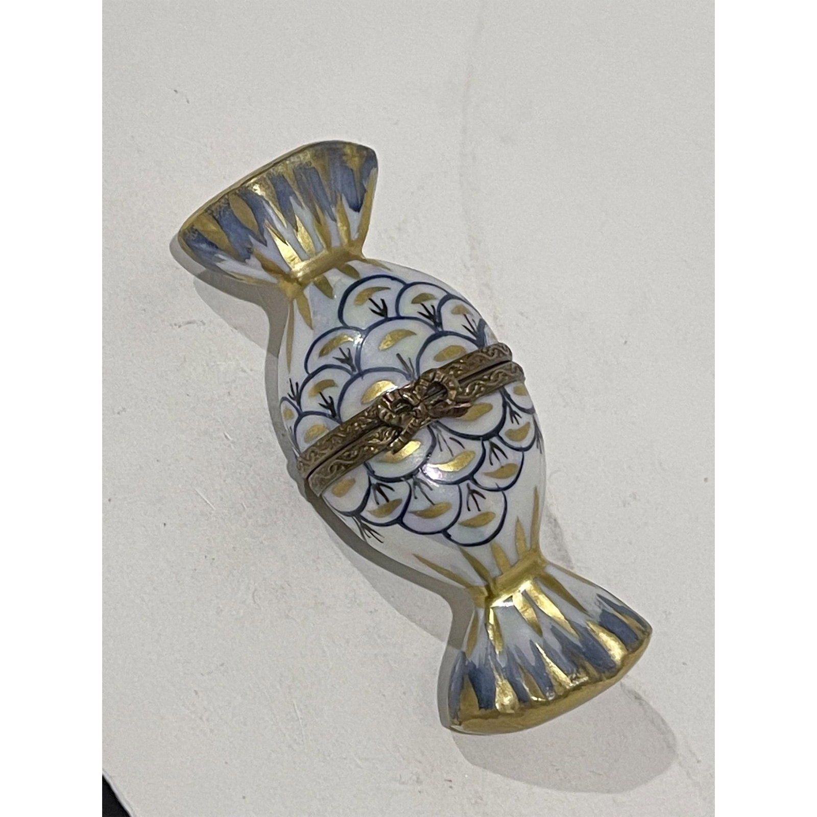 Limoges France Keepsake Box, Candy Wrapper with Fish Scales: Limited Edition wrapped candy mini box. 24K gold accented fish scale hand painting . Gilded bow at hinge that when opened reveals shows. MB 2000 16 of 50 JPM on inside top. Peint Main Limoges France o