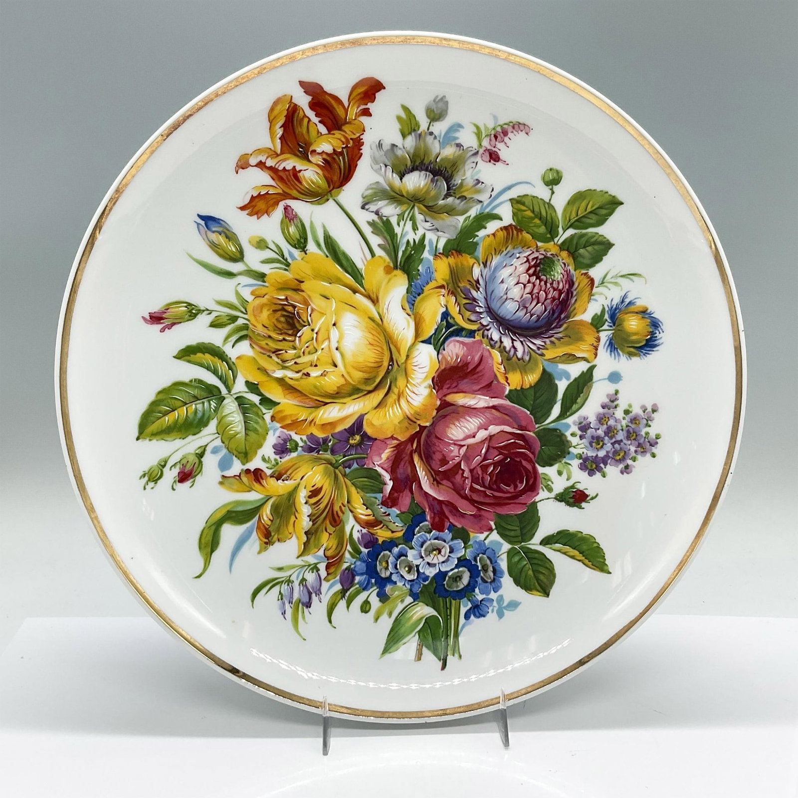 Vintage Italian Limoges Porcelain Floral Bowl: Crafted and inspired by Limoges French porcelain, this particular piece is Italian that features vibrant colored flowers and a gilt trim. Sticker on the underside marked: Copie de Limoges Porcelaines 