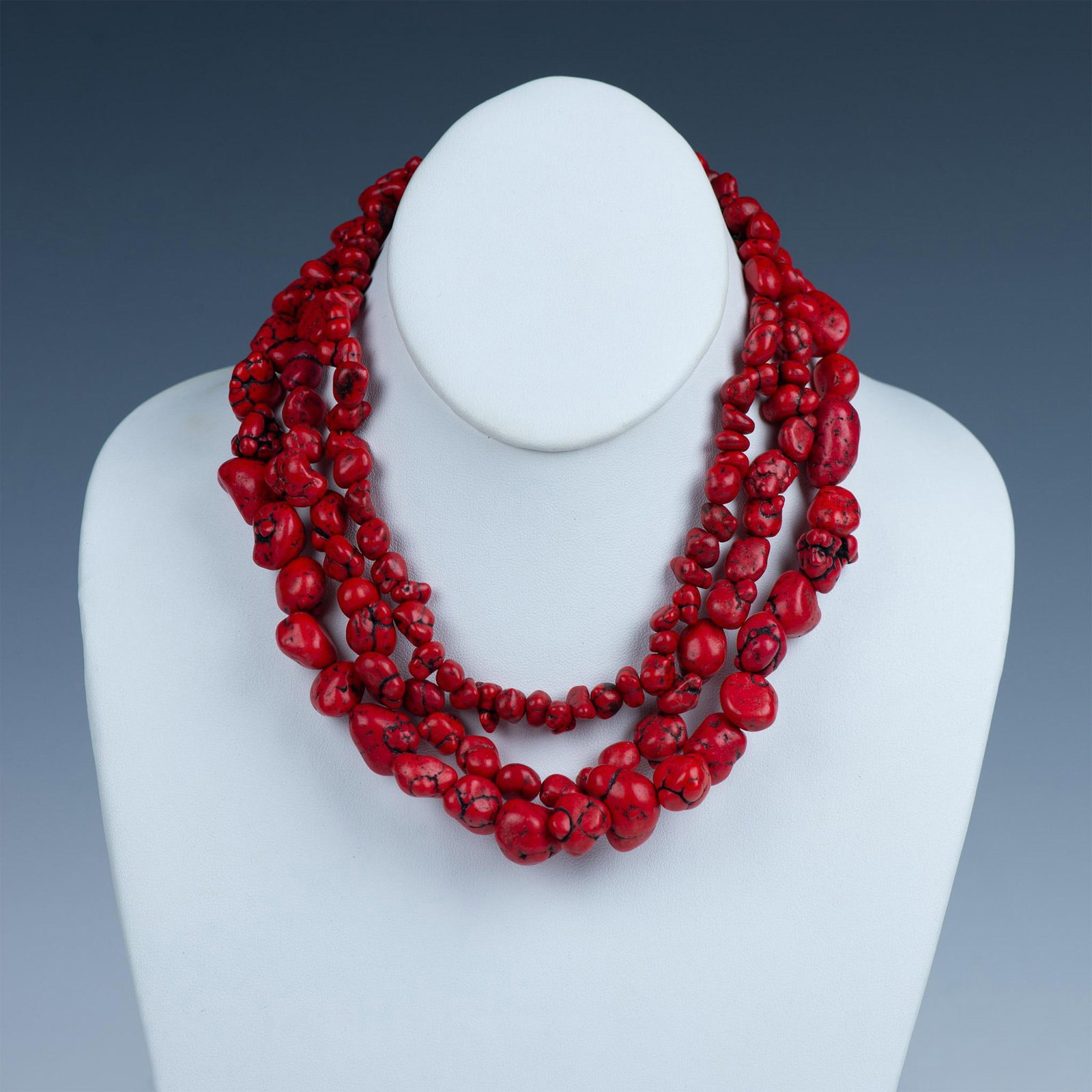 Bright Three-Strand Red Stone Necklace: This necklace has three strands of faux coral nugget beads. It measures approximately 19"L end to end, but can be adjusted shorter.