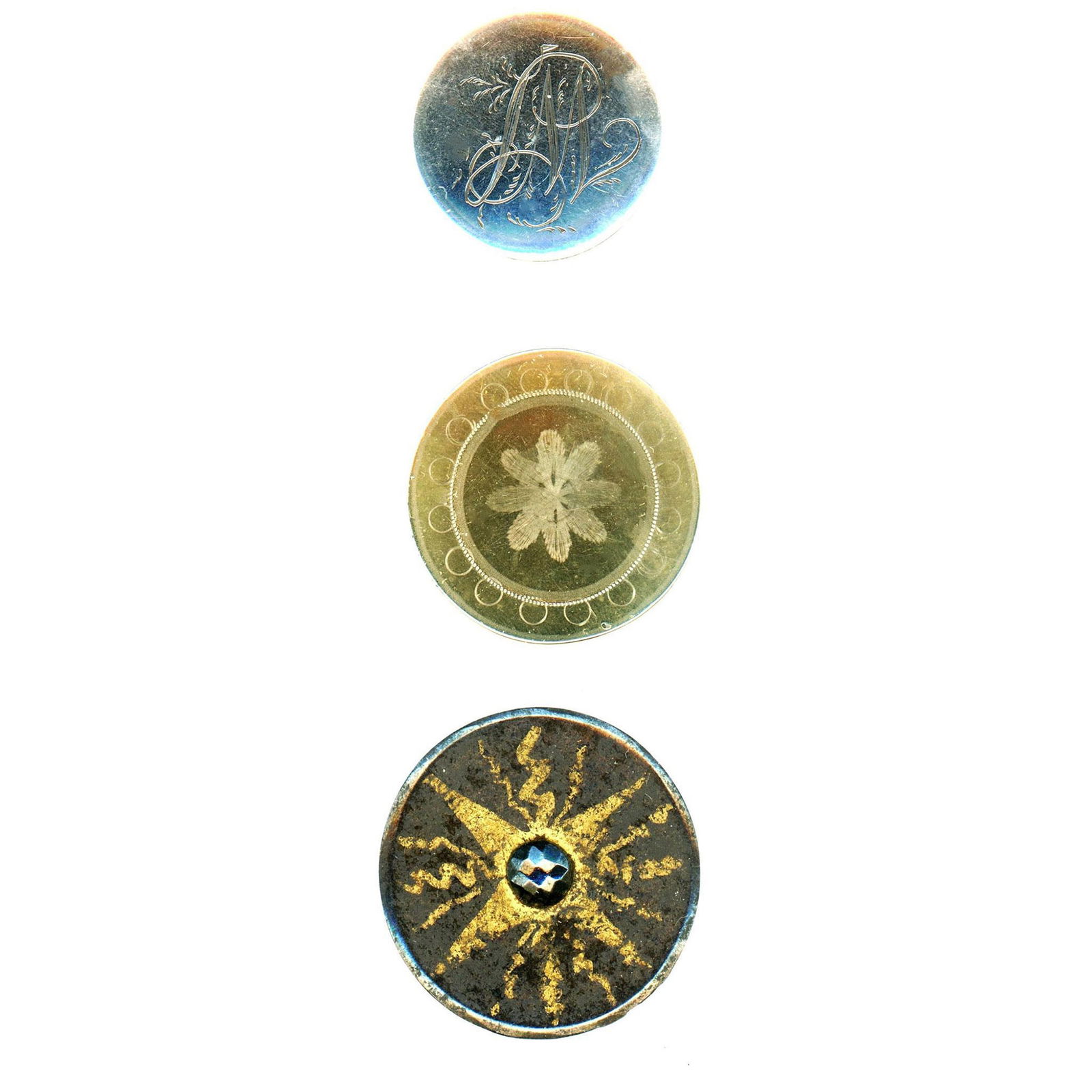 A small card of metal buttons including Tombac (1 of 3)