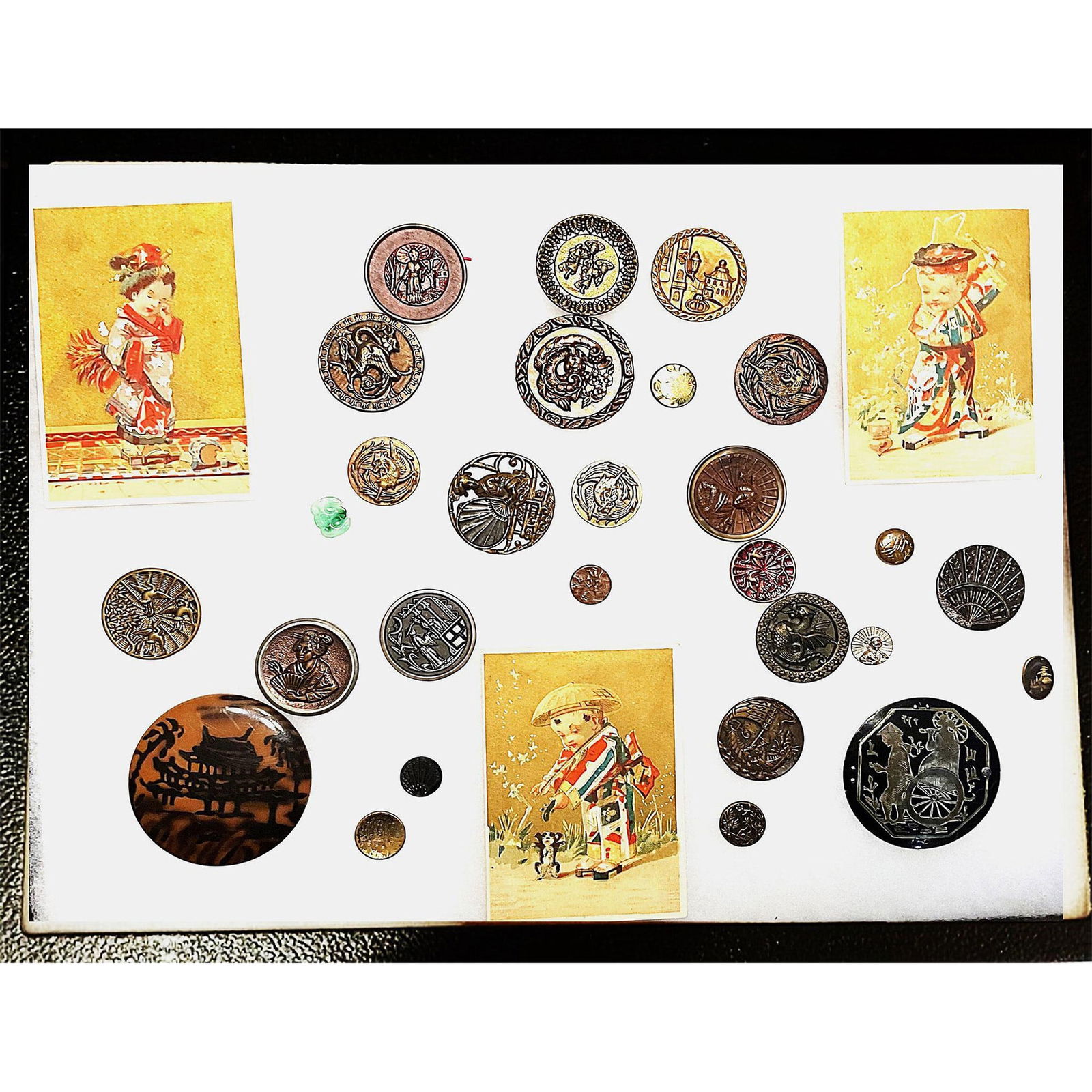 A Riker case of assorted buttons including Asian themed (1 of 6)